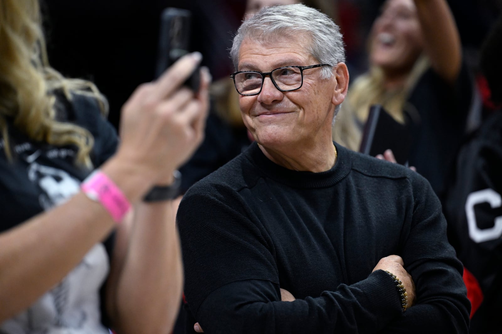 UConn head coach Geno Auriemma smiles as he is honored for the most wins in college basketball history, Wednesday, Nov. 20, 2024, in Storrs, Conn. (AP Photo/Jessica Hill)