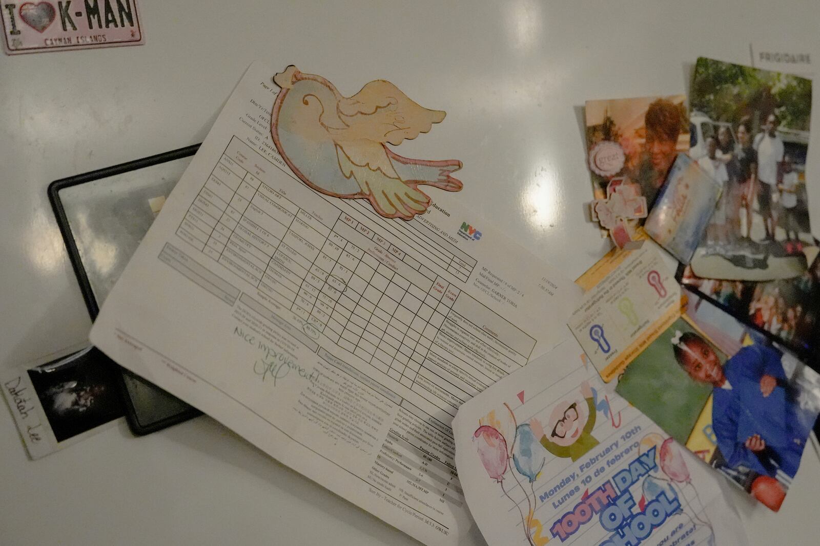 Camden Lee's report card hangs on the refrigerator in his family's apartment, Tuesday, Jan. 28, 2025, in the Brooklyn borough of New York. (AP Photo/Julia Demaree Nikhinson)