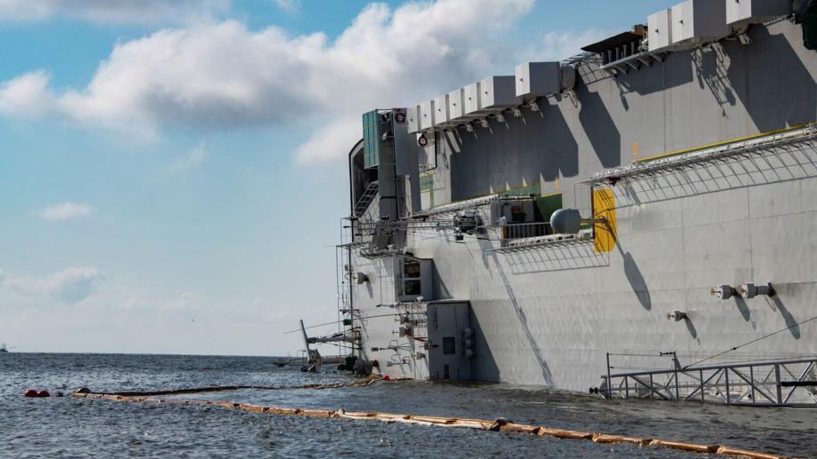 The capsized cargo vessel Golden Ray has had two large pollution discharges in recent days. Divers worked to locate the source of the discharge as crews placed containment booms around the vessel, but residents say the shoreline has been impacted.