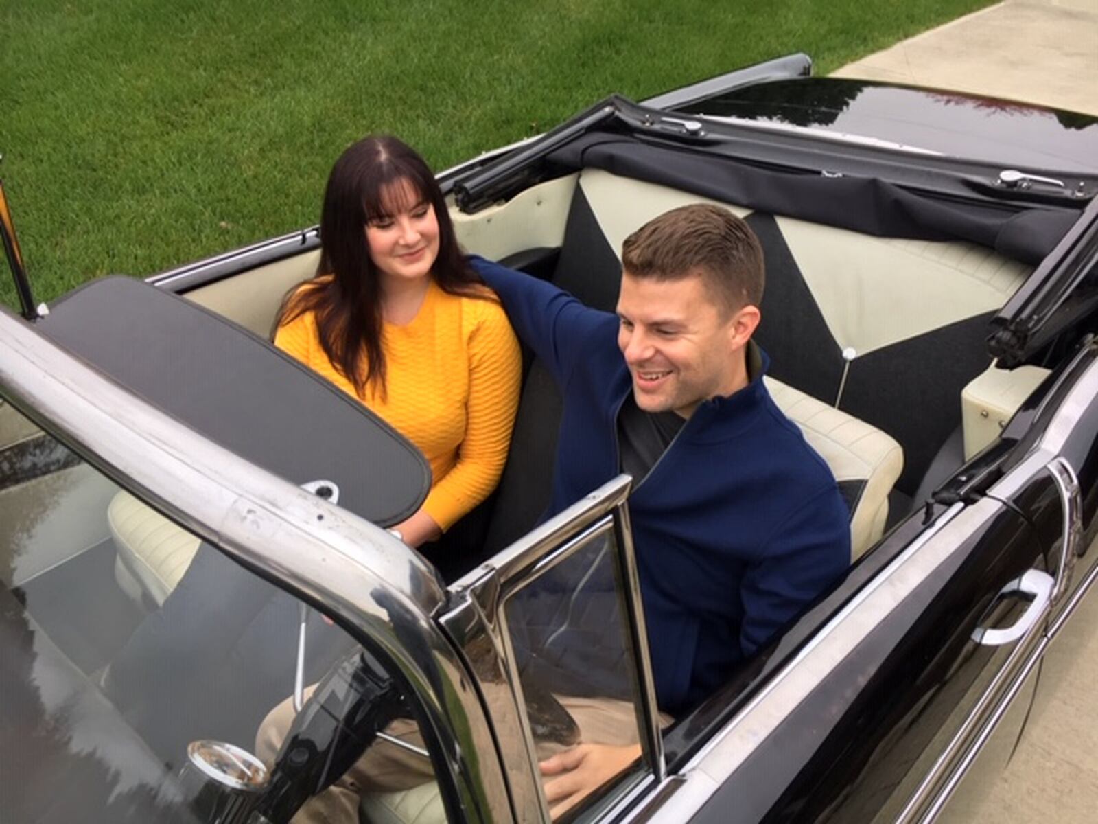 Jay Schmitt, with his wife Ashley, in their 1956 Chevrolet Bel-Air convertible, the last car Jay Schmitt’s father Jeff Schmitt purchased, three months before the older Schmitt’s death in October 2018. THOMAS GNAU/STAFF