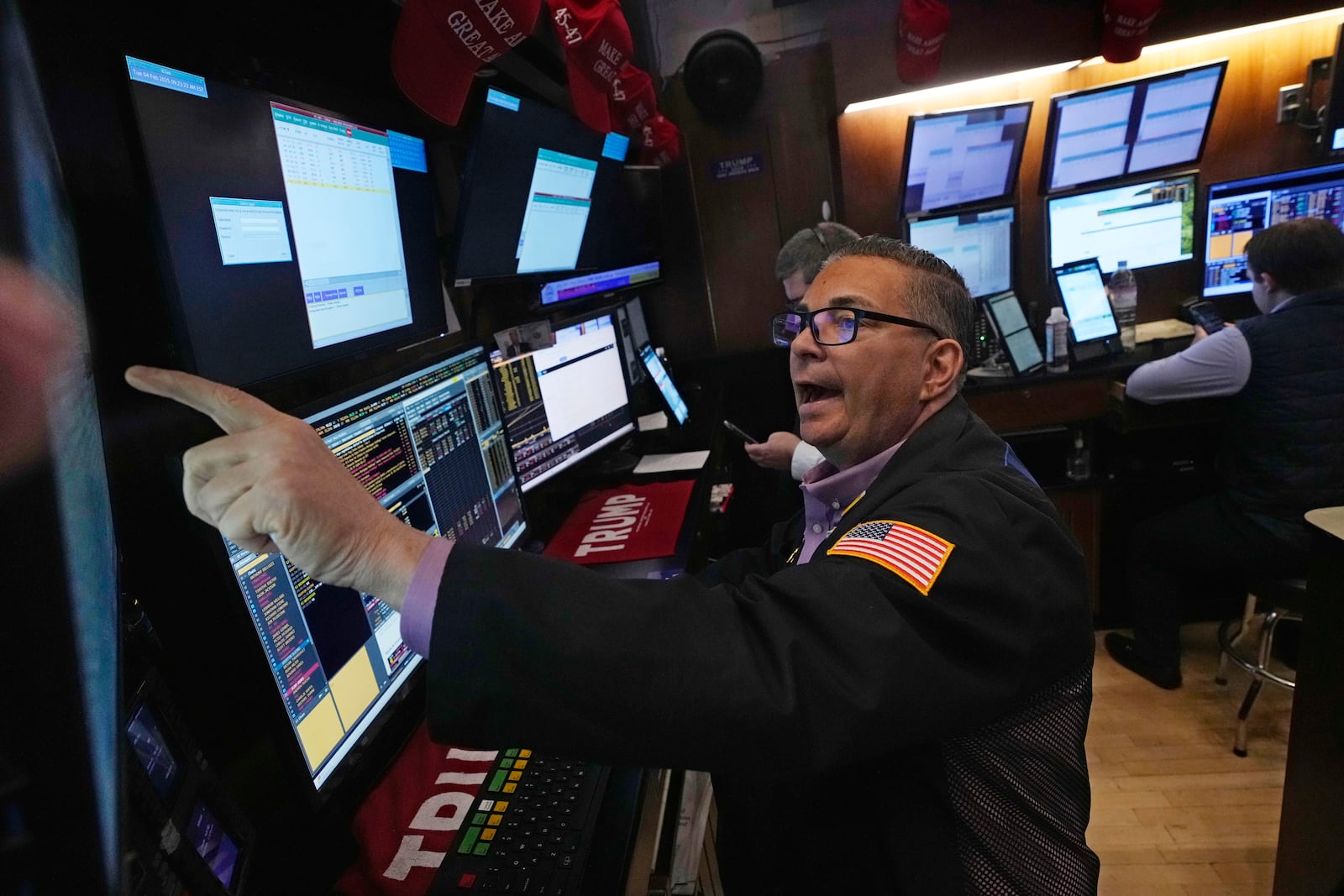 Trader Jonathan Mueller works on the floor of the New York Stock Exchange, Tuesday, Feb. 4, 2025. (AP Photo/Richard Drew)