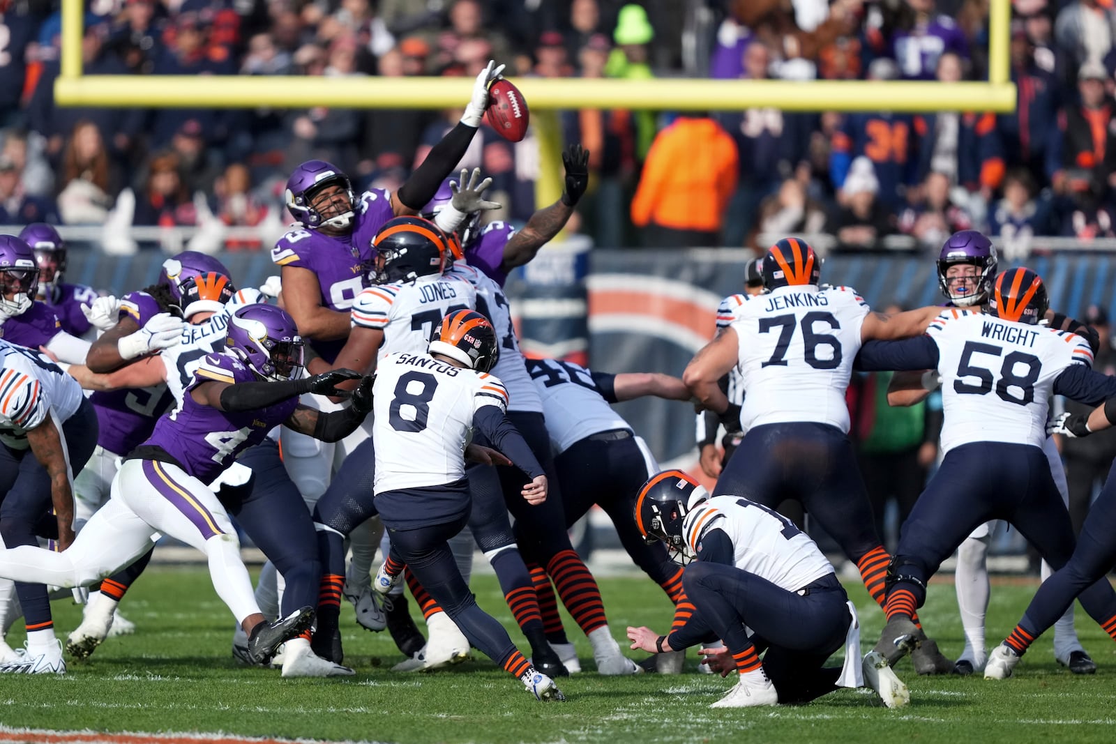 Minnesota Vikings defensive tackle Jerry Tillery, top center, blocks a field goal attempt by Chicago Bears place kicker Cairo Santos during the first half of an NFL football game Sunday, Nov. 24, 2024, in Chicago. (AP Photo/Charles Rex Arbogast)