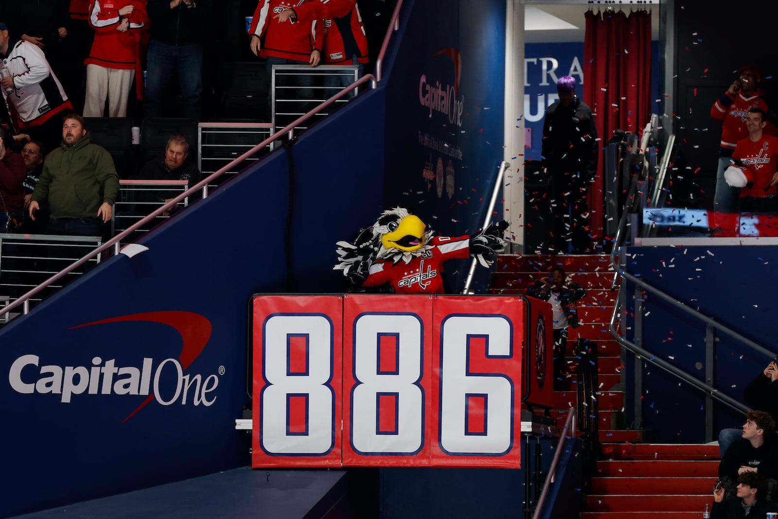 The Washington Capitals mascot celebrates after left wing Alex Ovechkin, not pictured, scores his 886th goal during the third period of an NHL hockey game against the Seattle Kraken, Sunday, March 9, 2025, in Washington. (AP Photo/Terrance Williams)