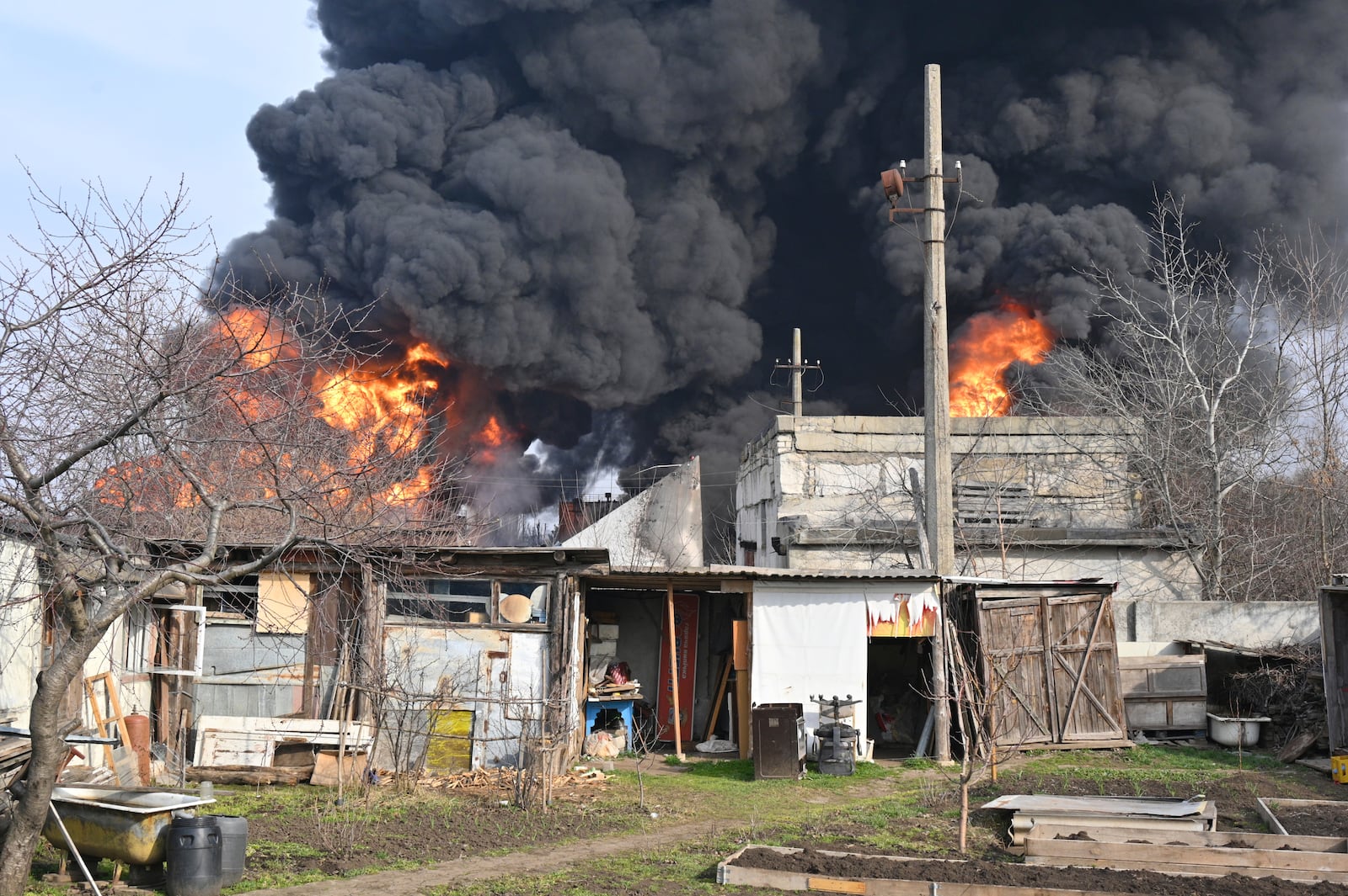 Fuel reservoirs fire following a Russian drone attack near Odesa, Ukraine, Tuesday, March 11, 2025. (AP Photo/Michael Shtekel)