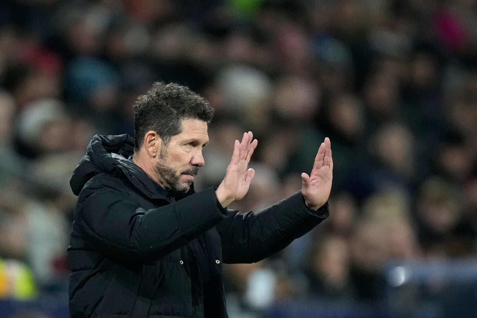 Atletico Madrid's head coach Diego Simeone gives directions to his players during the Champions League opening phase soccer match between FC Salzburg and Atletico Madrid at the Salzburg Arena in Salzburg, Austria, Wednesday, Jan. 29, 2025. (AP Photo/Matthias Schrader)