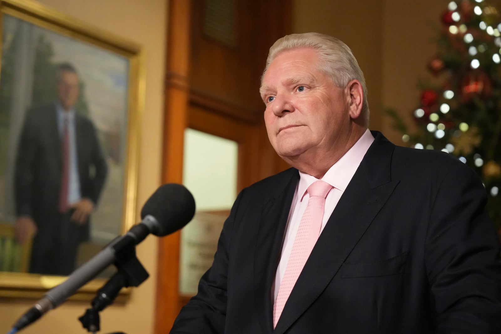 Ontario Premier Doug Ford speaks to the media outside of his office at the Ontario Legislature, in Toronto, on Wednesday, Dec. 11, 2024. (Chris Young/The Canadian Press via AP)