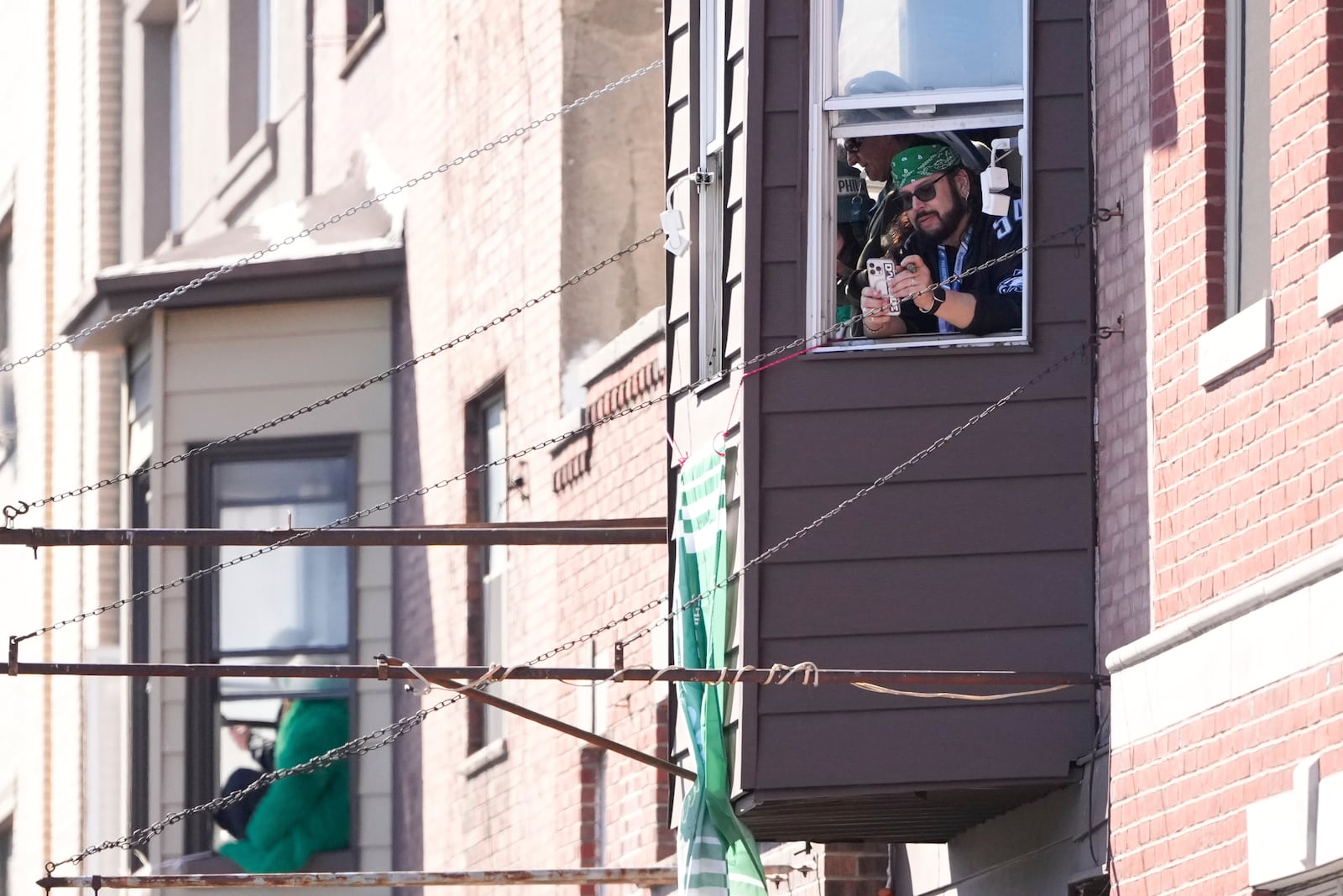 Fans wait before the Philadelphia Eagles' NFL football Super Bowl 59 parade and celebration, Friday, Feb. 14, 2025, in Philadelphia. (AP Photo/Matt Slocum)