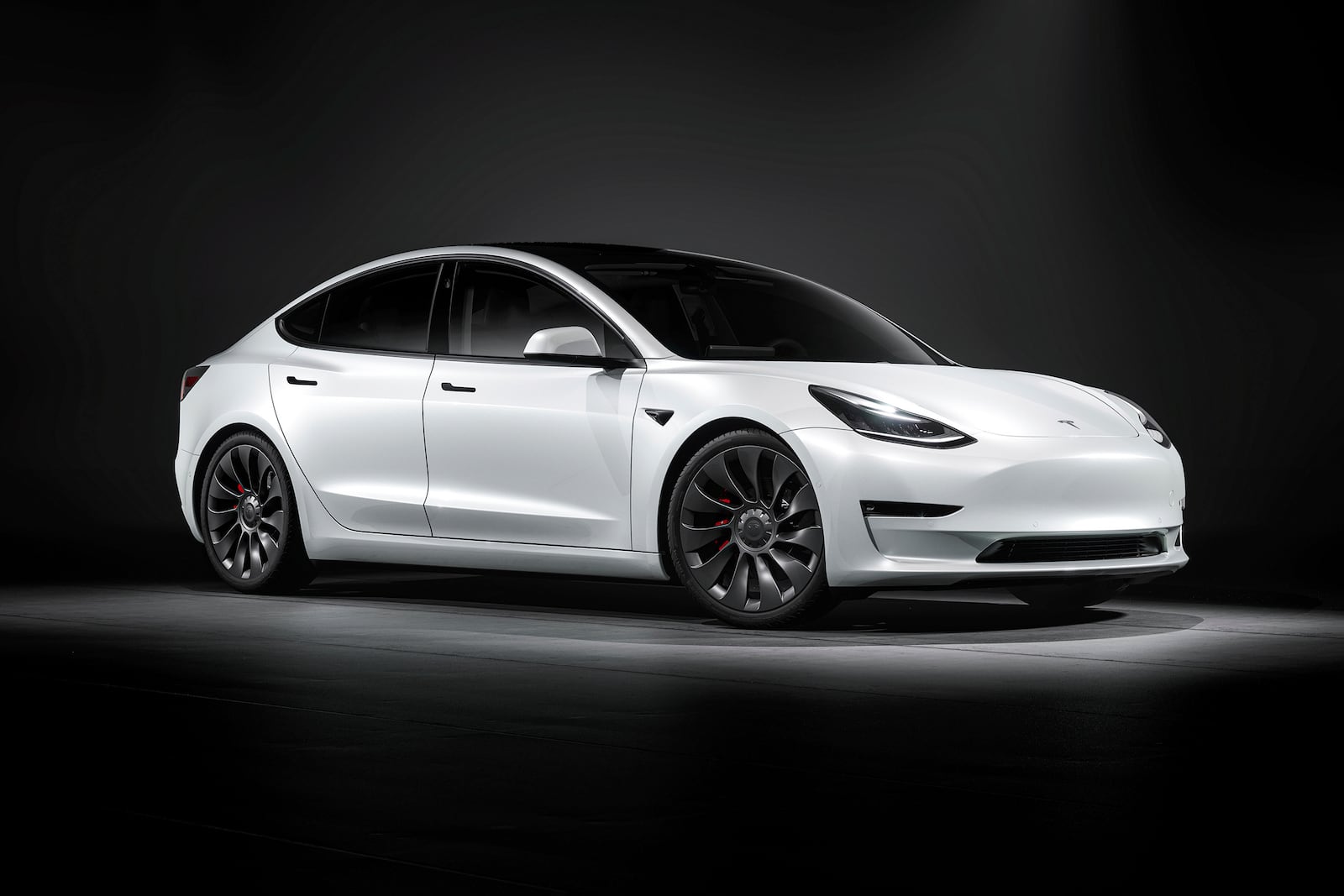 This photo provided by Tesla shows the 2022 Tesla Model 3, which is available used with all-wheel drive for less than $25,000. Look for a Long Range trim to stay within this price range. (Courtesy of Tesla via AP)