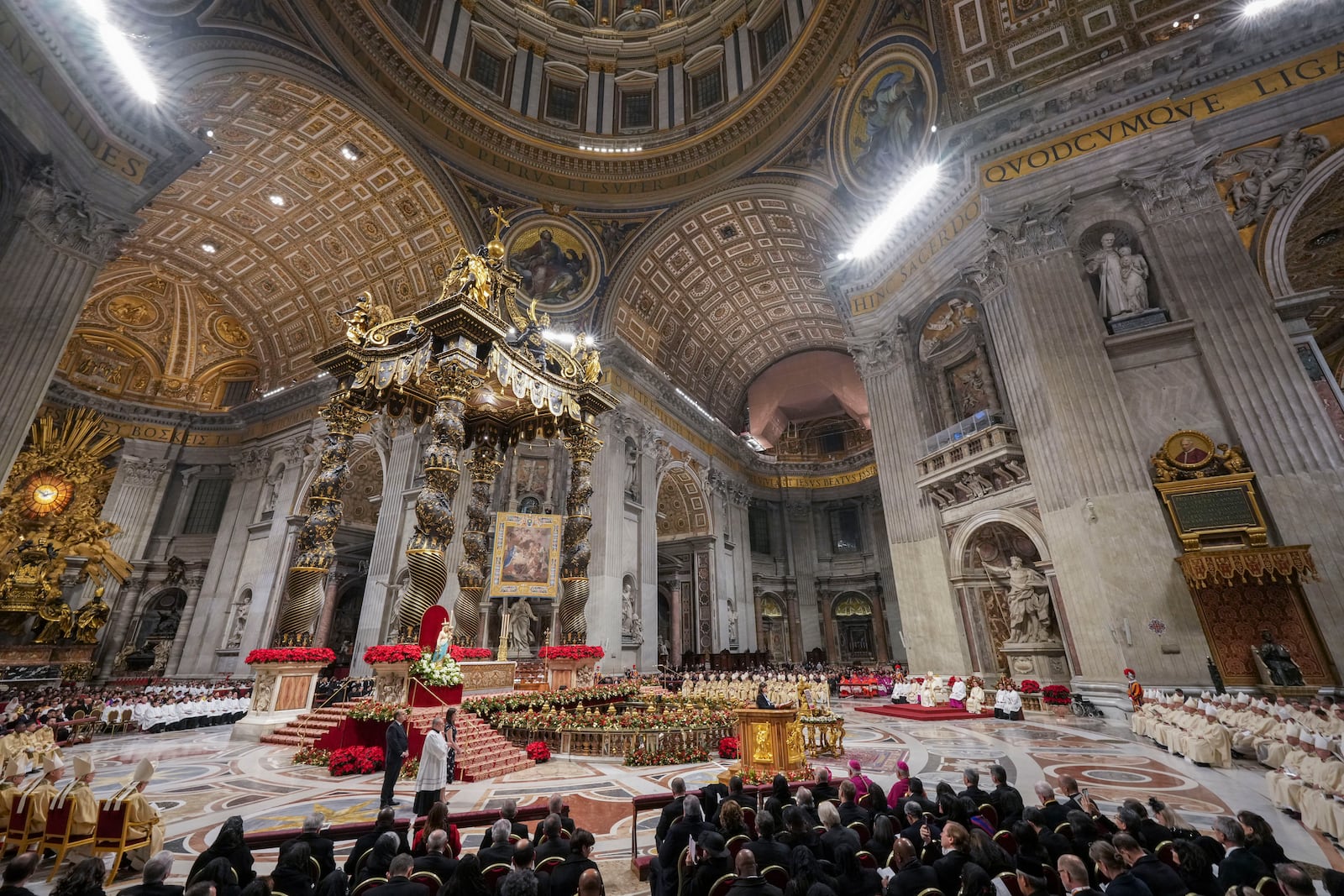 Pope Francis presides over the Christmas Eve Mass in St. Peter's Basilica at The Vatican, Tuesday, Dec. 24, 2024, after opening the basilica's holy door marking the start of the Catholic jubilar year 2025. (AP Photo/Andrew Medichini)