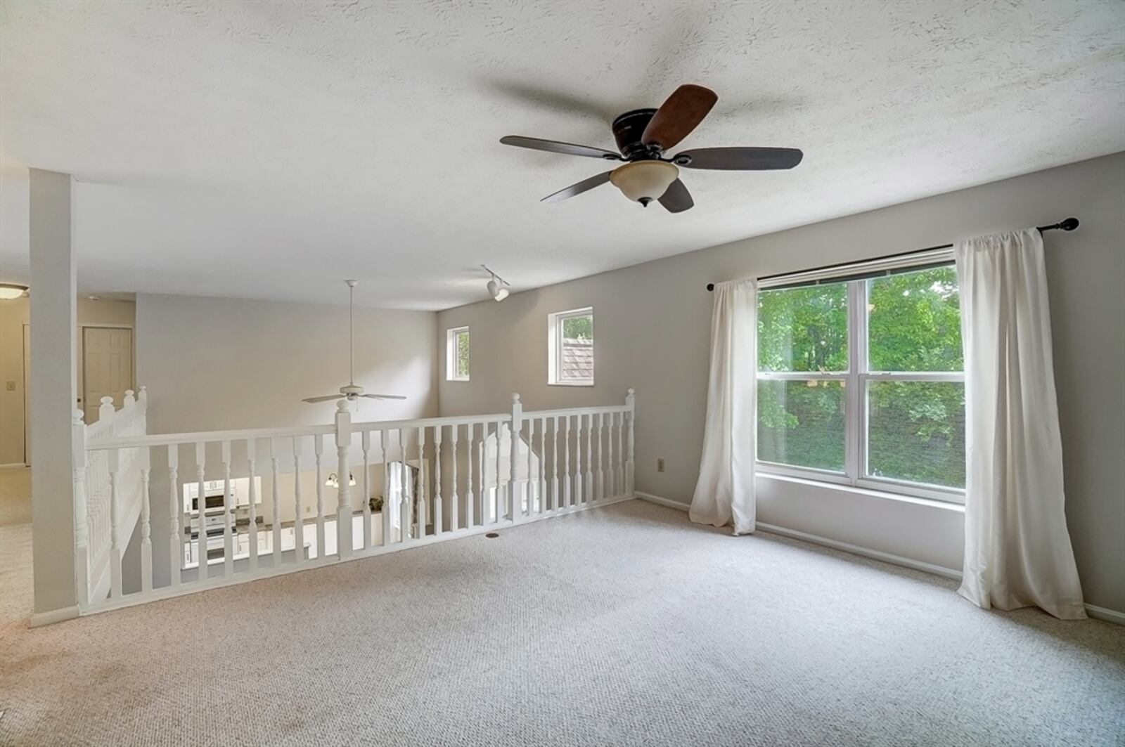 The family room loft has plenty of natural light.