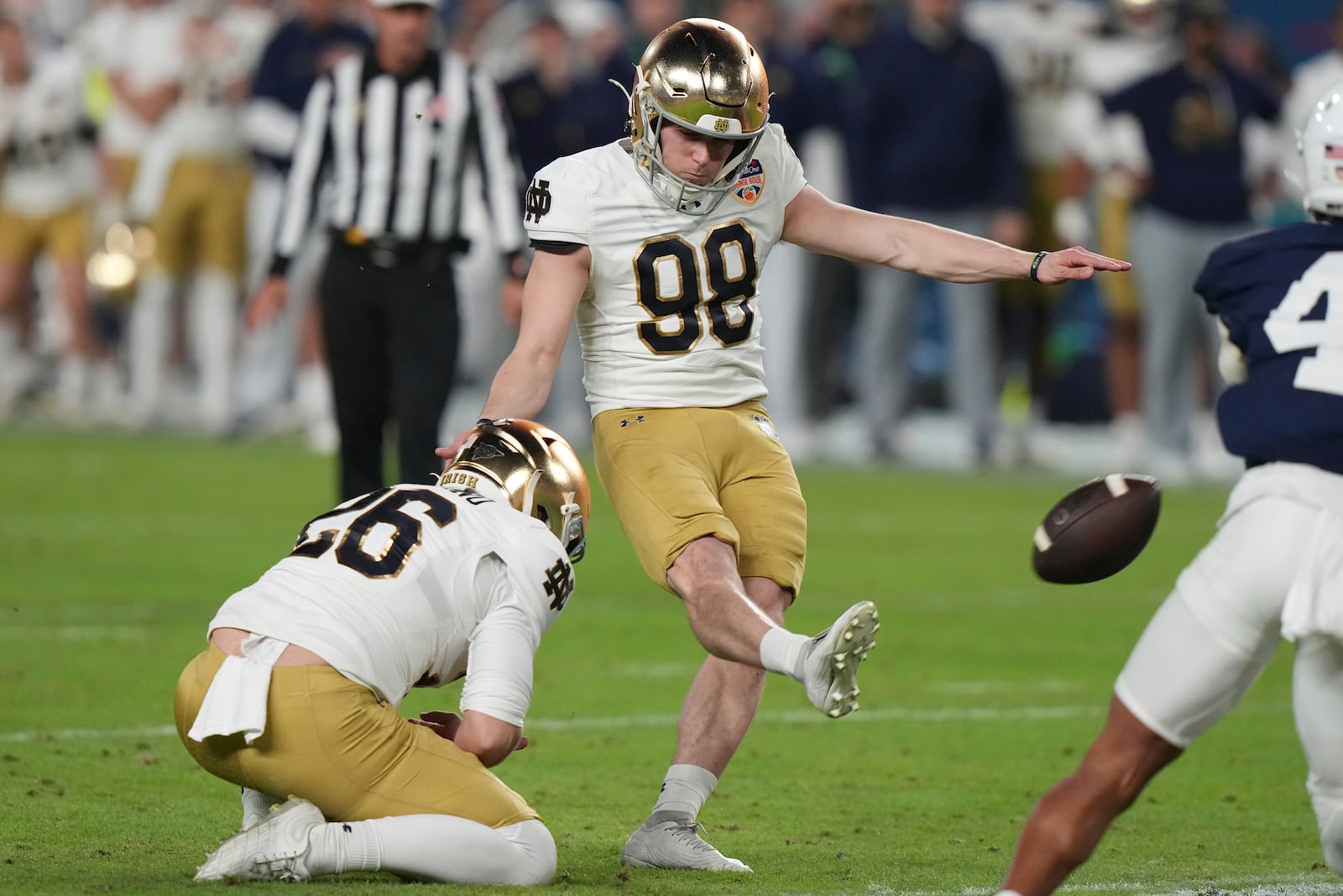 Notre Dame place kicker Mitch Jeter (98) kicks the game winning field goal during the second half of the Orange Bowl College Football Playoff semifinal game against Penn State, Thursday, Jan. 9, 2025, in Miami Gardens, Fla. (AP Photo/Lynne Sladky)