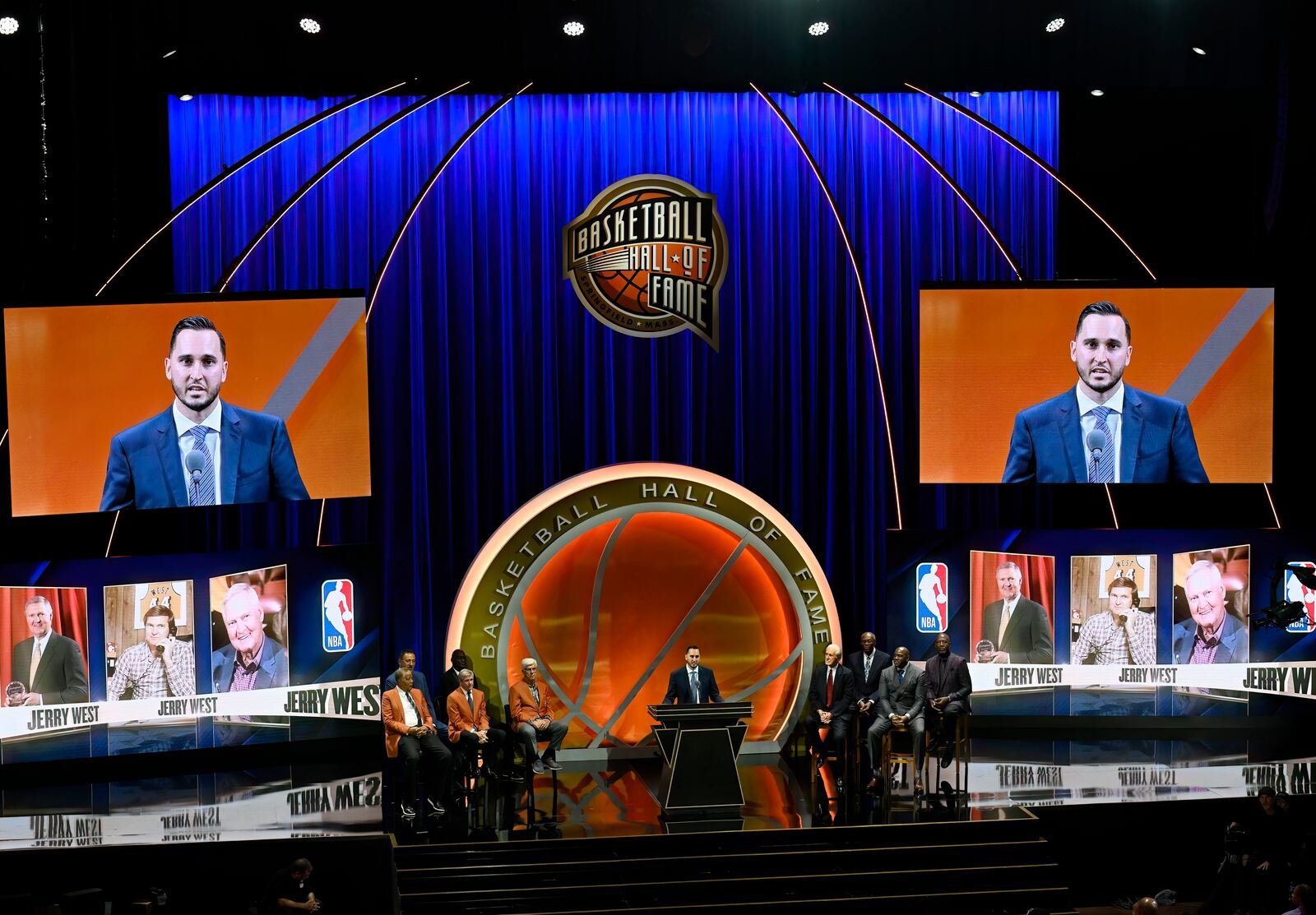 Jonnie West, center, speaks during his late father Jerry West's enshrinement in the Basketball Hall of Fame, Sunday Oct. 13, 2024, in Springfield, Mass. (AP Photo/Jessica Hill)