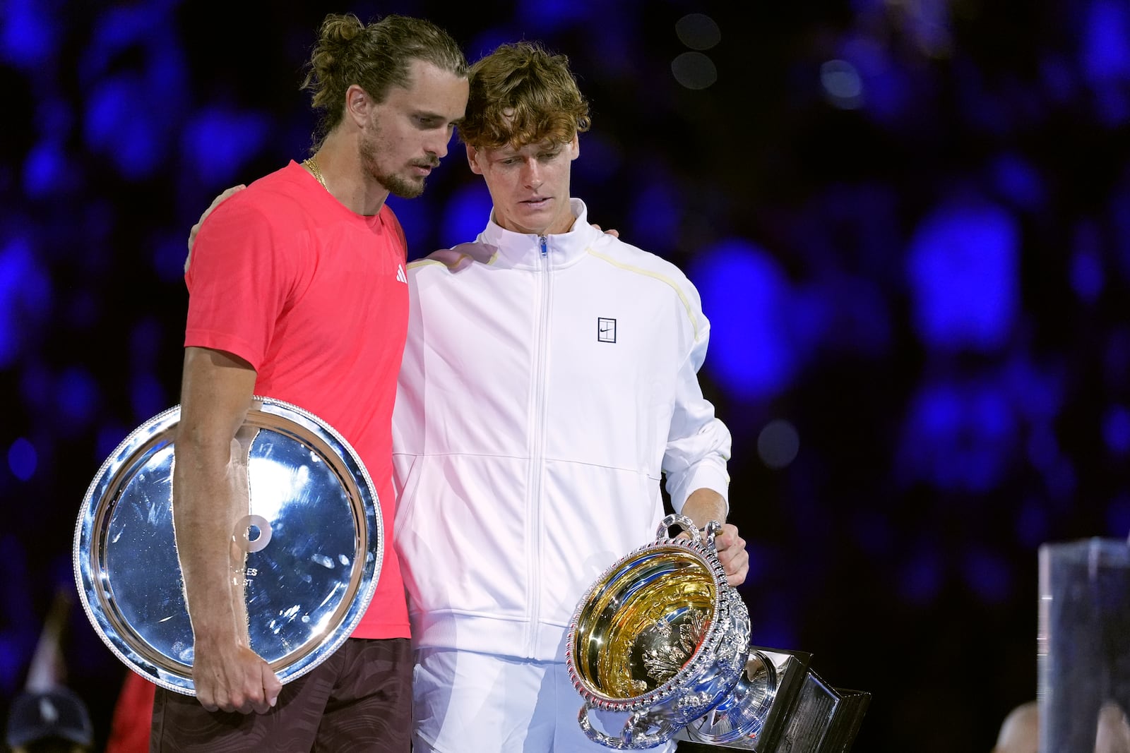 Jannik Sinner, right, of Italy talks with Alexander Zverev of Germany after his win in the men's singles final at the Australian Open tennis championship in Melbourne, Australia, Sunday, Jan. 26, 2025. (AP Photo/Ng Han Guan)