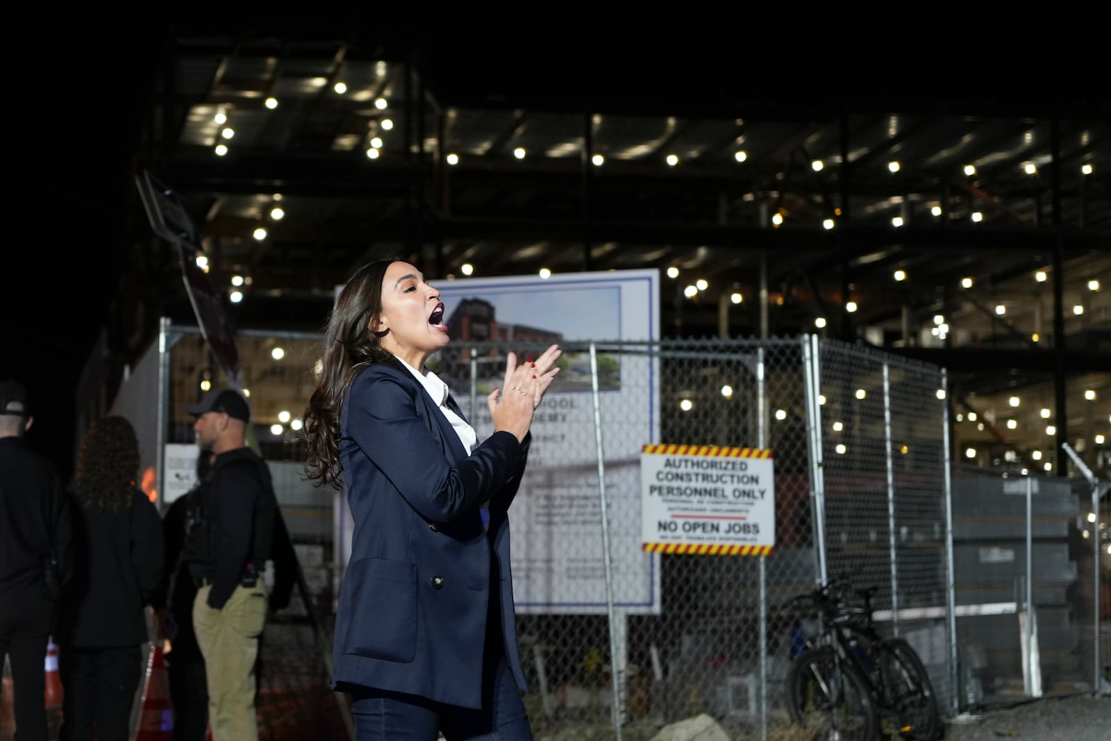 New York Rep. Alexandria Ocasio-Cortez greets supporters of Kamala Harris outside a Puerto Rican restaurant that Harris visited in Reading, Pa., Monday, Nov. 4, 2024. (AP Photo/Luis Andres Henao)