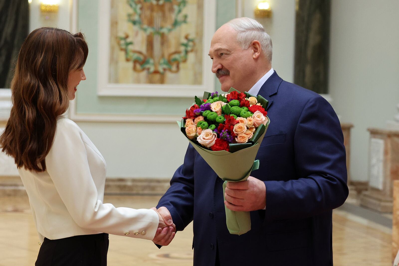 In this photo released by Belarus' Presidential Press Service, Belarusian President Alexander Lukashenko, right, takes part in an industry award ceremony in Minsk, Belarus, on Thursday, Jan. 23, 2025. (Belarus' Presidential Press Service via AP)