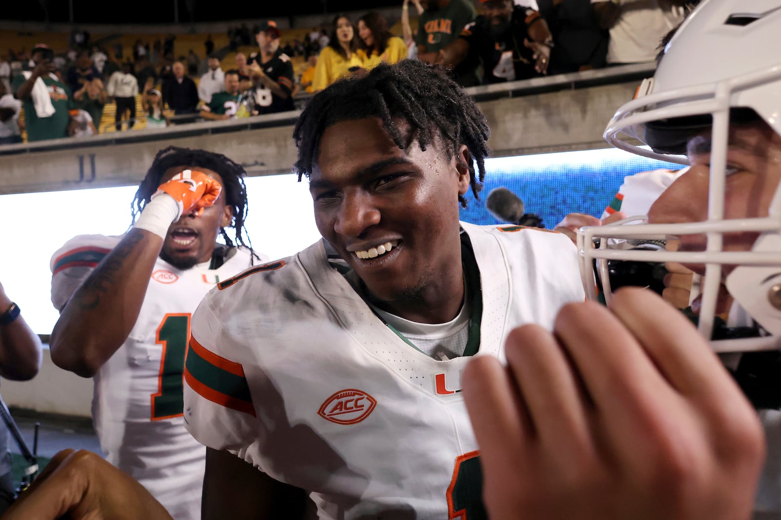 Miami quarterback Cam Ward (1) celebrates after defeating California during an NCAA college football game in Berkeley, Calif., Saturday, Oct. 5, 2024. (AP Photo/Jed Jacobsohn)