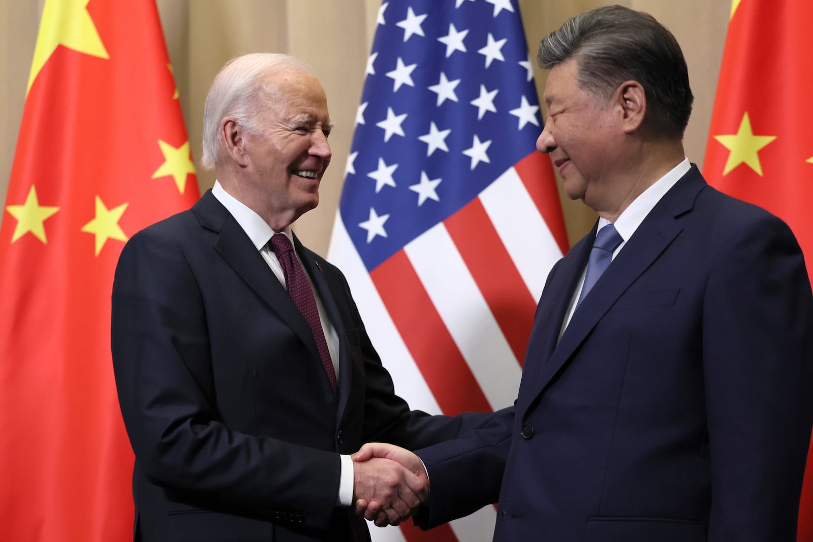 President Joe Biden shakes hands with Chinese President Xi Jinping before a bilateral meeting, Saturday, Nov. 16, 2024, in Lima, Peru. (Leah Millis/Pool Photo via AP)