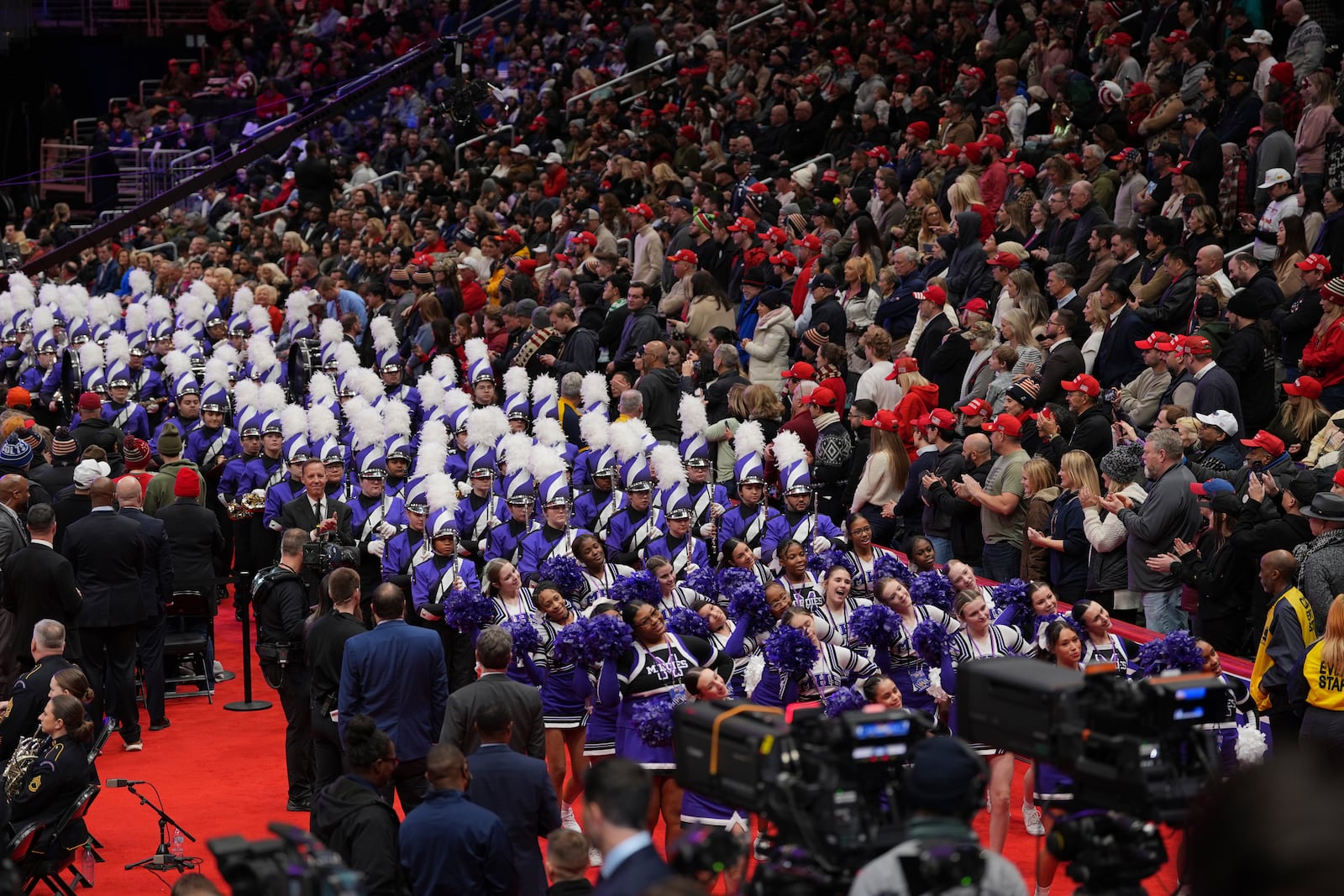 Students from Middletown High School in Ohio march at an indoor Presidential Inauguration parade event in Washington, Monday, Jan. 20, 2025. (AP Photo/Matt Rourke)