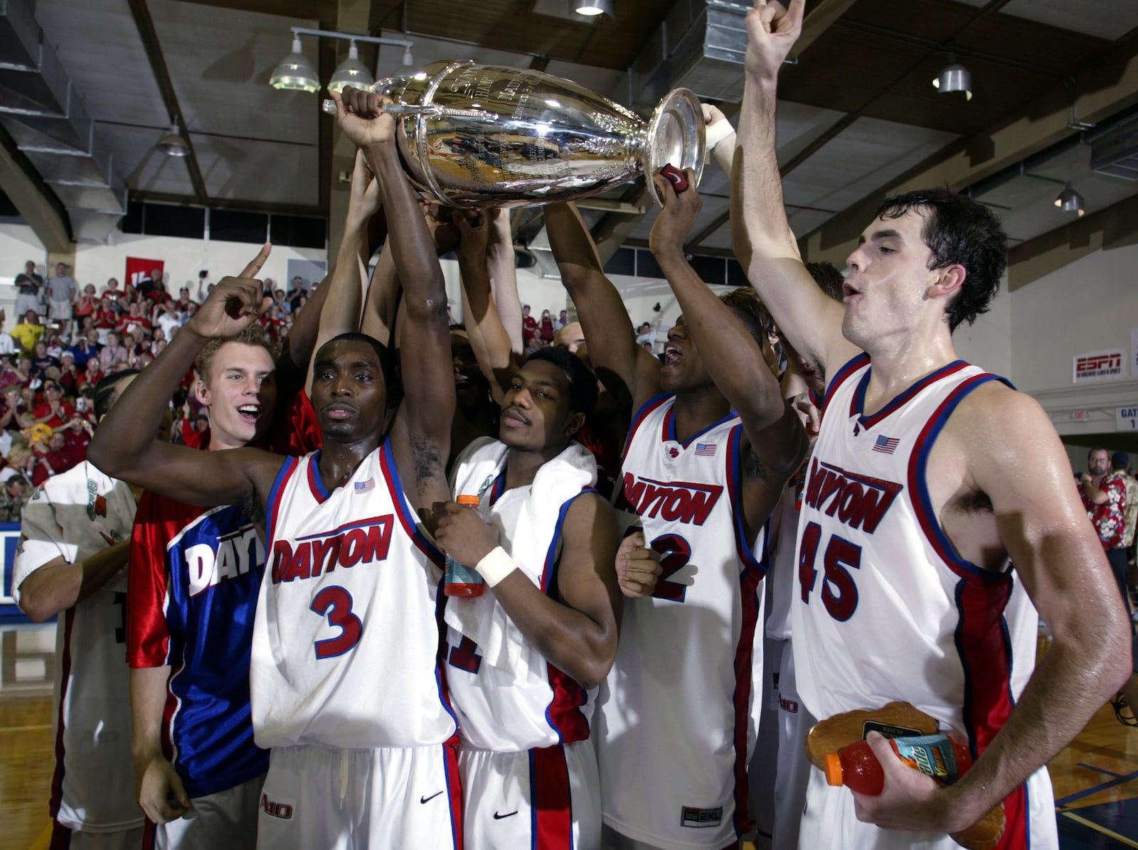 Dayton players, from left to right, Greg Kohls, Ramad Marshall, Warren Williams, Frank Iguodala and Keith Waleskowski celebrate with the championship trophy after defeating Hawaii, 82-72, in the championship game at the Maui Invitational in Lahaina, Hawaii on Wednesday, Nov. 26, 2003. (AP Photo/Michael Conroy)