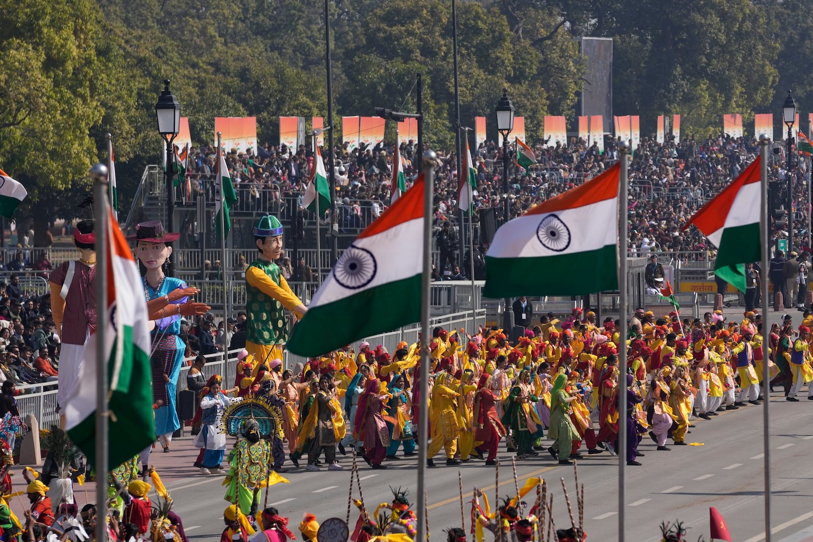 Indian artists in traditional outfits dance at the ceremonial Kartavya Path during India's Republic Day parade celebrations in New Delhi, India, Sunday, Jan. 26, 2025. (AP Photo/Channi Anand)