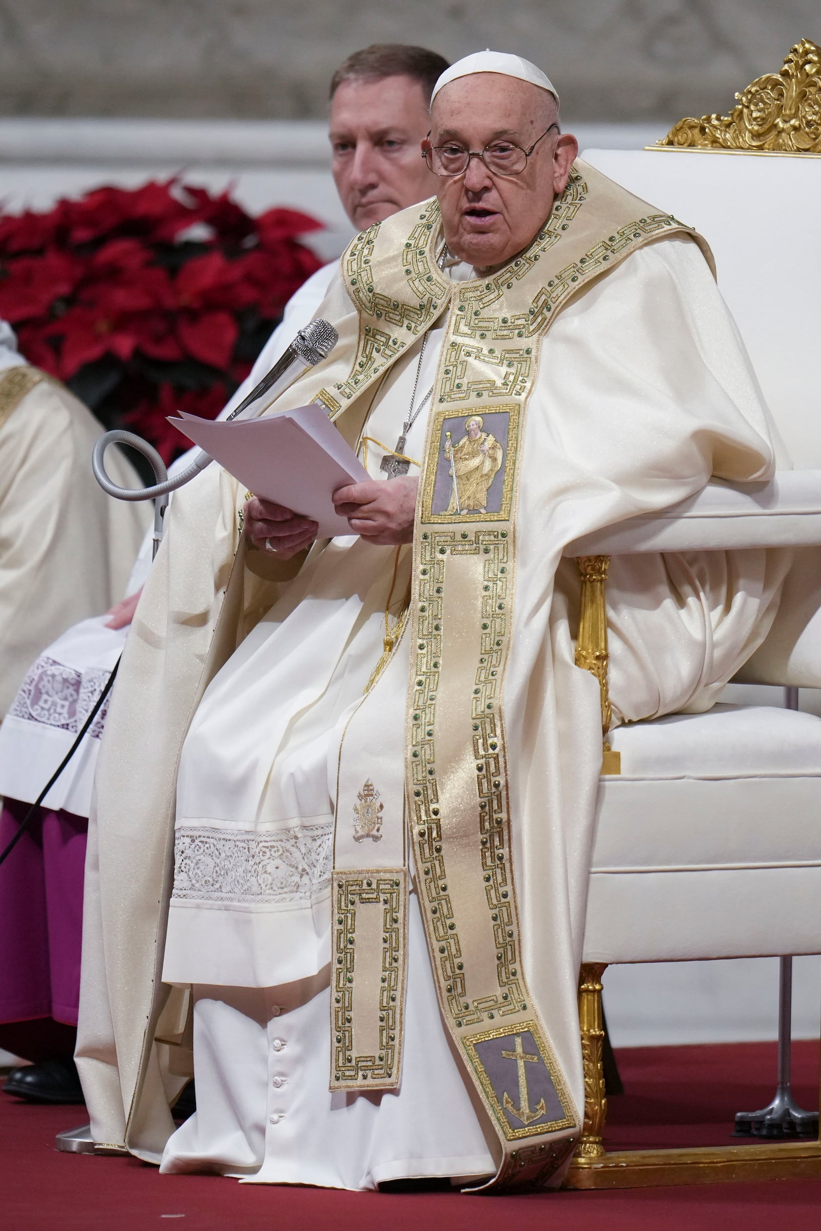 Pope Francis presides over the Christmas Eve Mass in St. Peter's Basilica at The Vatican, Tuesday, Dec. 24, 2024, after opening the basilica's holy door marking the start of the Catholic jubilar year 2025. (AP Photo/Andrew Medichini)