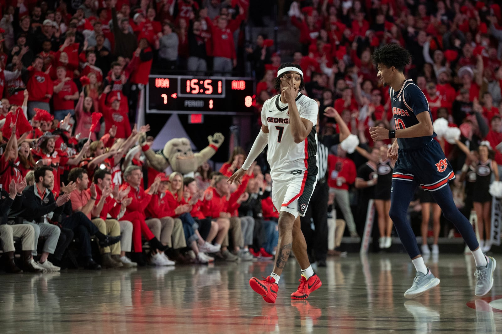 Georgia guard Tyrin Lawrence (7) celebrates his 3-point shot during the first half of an NCAA college basketball game against Auburn on Saturday, Jan. 18, 2025, in Athens, Ga. (AP Photo/Kathryn Skeean)