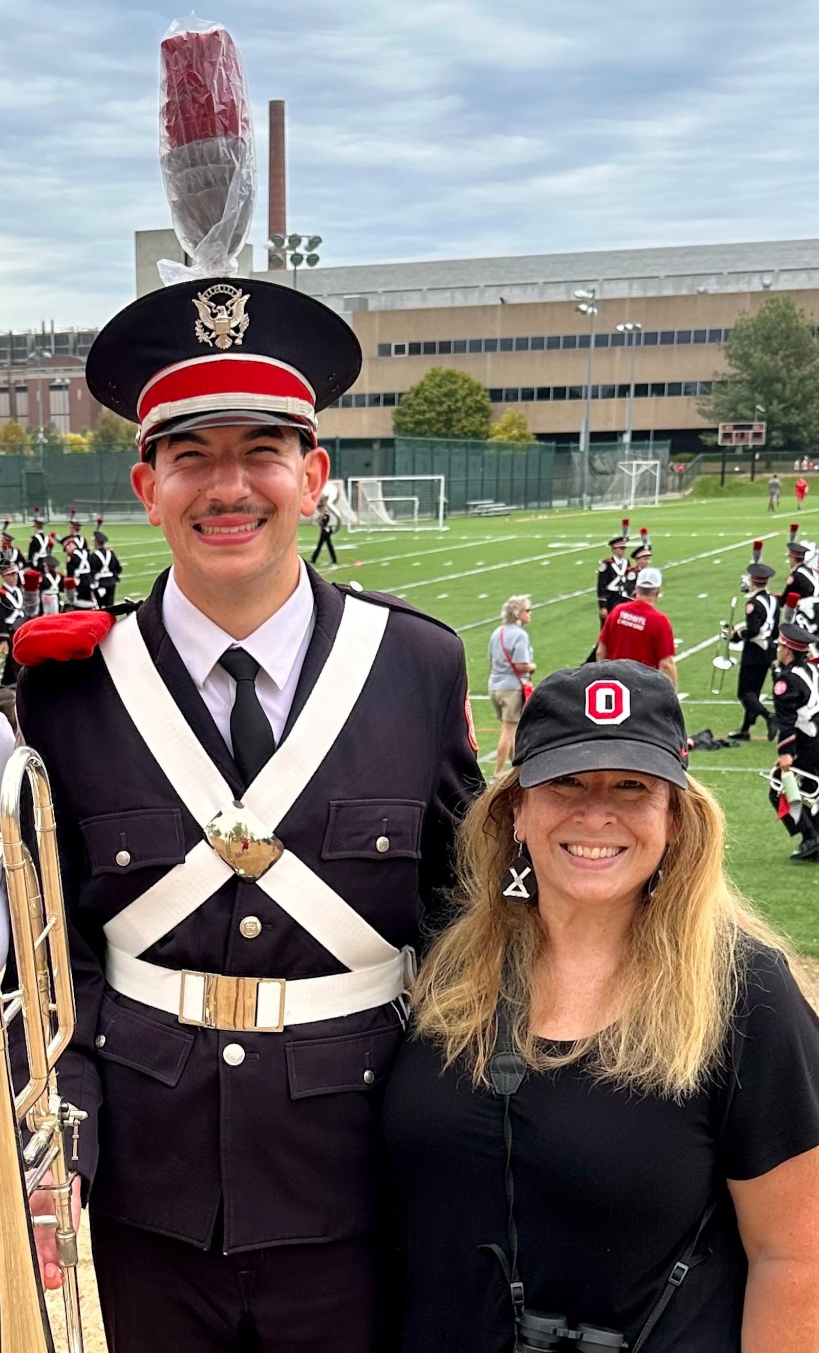 Springfield High grad and Ohio State Marching Band member Reese Hiller-Freund with his mother Darby. Contributed photo