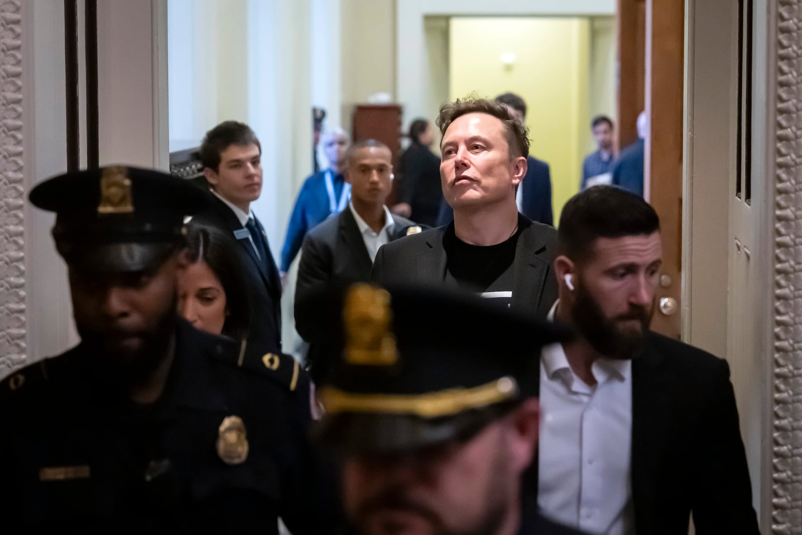 Elon Musk leaves after meeting with Senate Republicans, at the Capitol in Washington, Wednesday, March 5, 2025. (AP Photo/Ben Curtis)