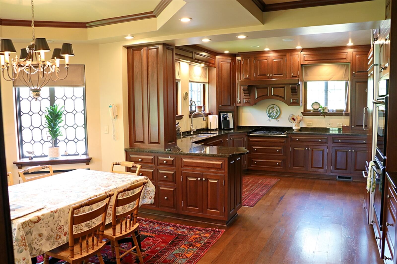 The kitchen has been updated with cherry cabinetry that offers storage space for just about every appliance. 