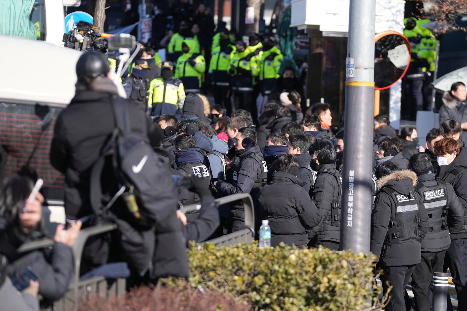 Police officers leave from the presidential residence of impeached President Yoon Suk Yeol in Seoul, South Korea, Wednesday, Jan. 15, 2025. (AP Photo/Lee Jin-man)