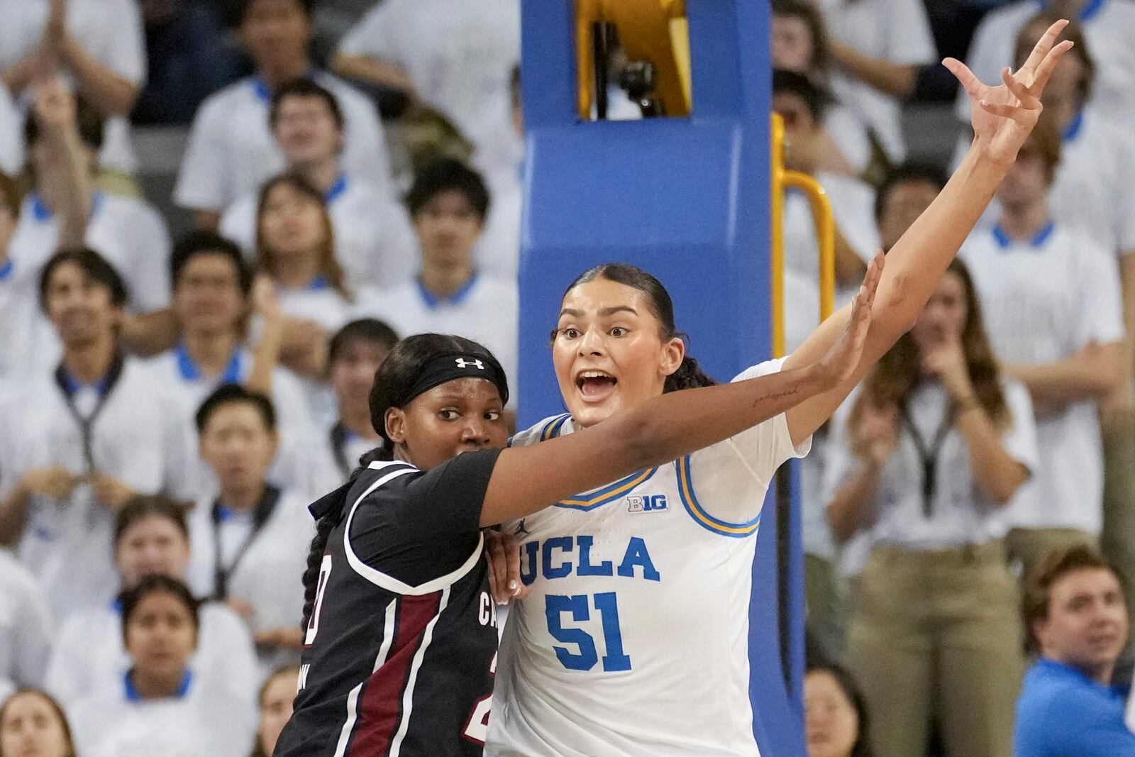 UCLA center Lauren Betts (51) calls for a pass against South Carolina forward Sania Feagin during the first half of an NCAA college basketball game, Sunday, Nov. 24, 2024, in Los Angeles. (AP Photo/Eric Thayer)