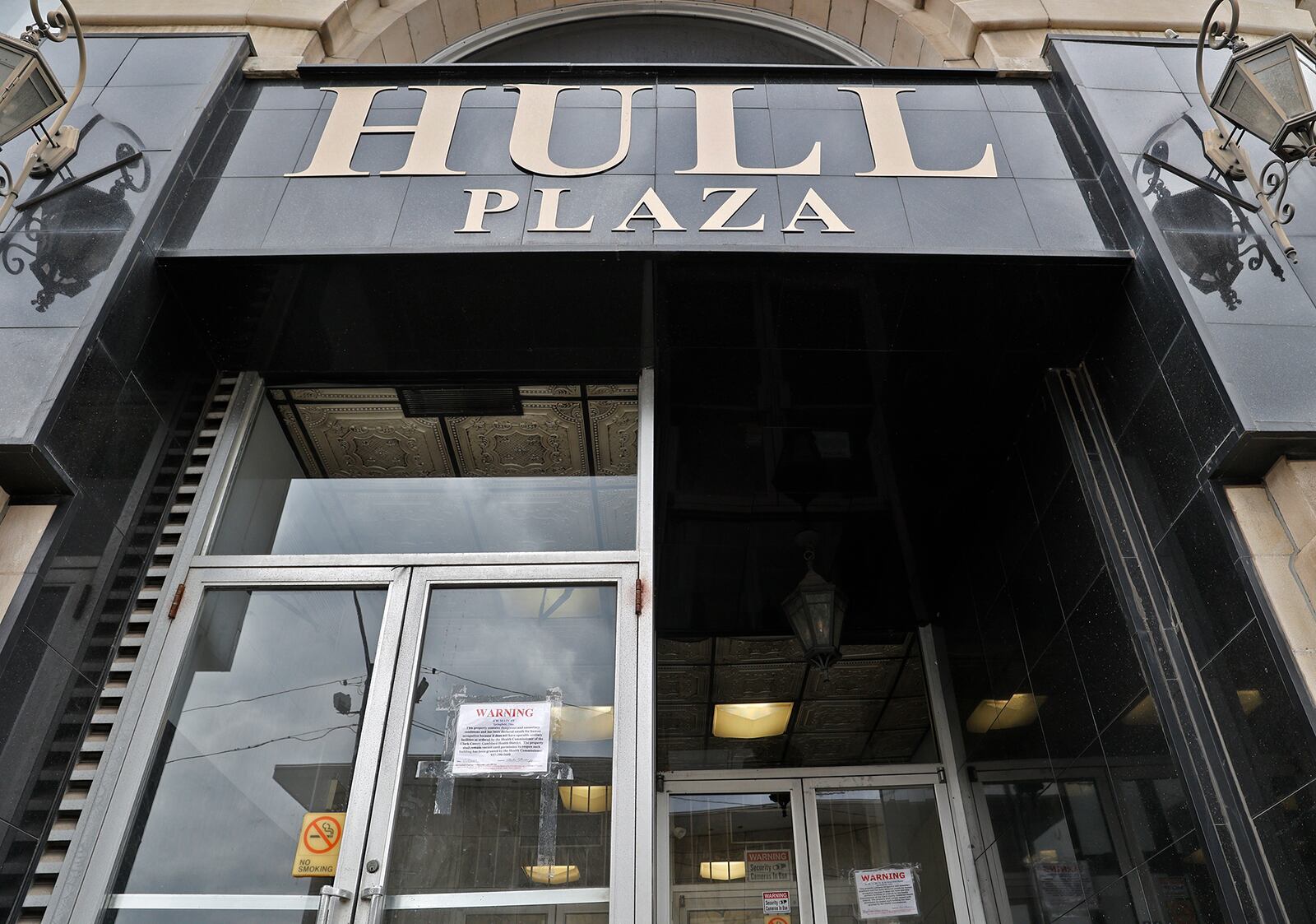 Hull Plaza, at 4 W. Main Street in downtown Springfield, has been  closed by an emergency order from the Clark County Combined Health District. BILL LACKEY/STAFF