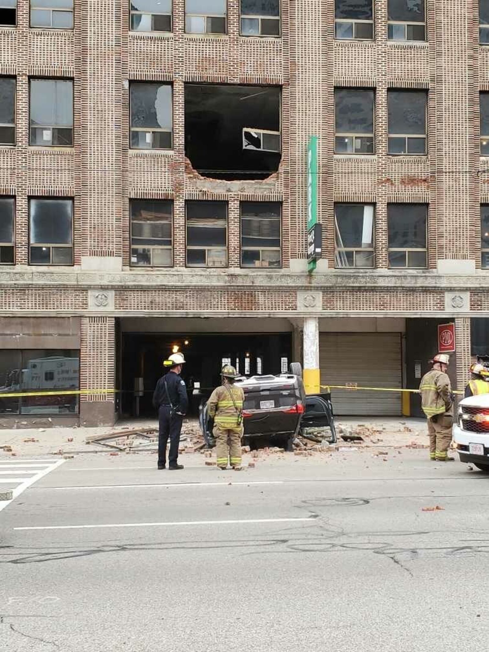 Police and medics responded to a parking garage on West First Street in Dayton Thursday morning after a vehicle fell off an upper level