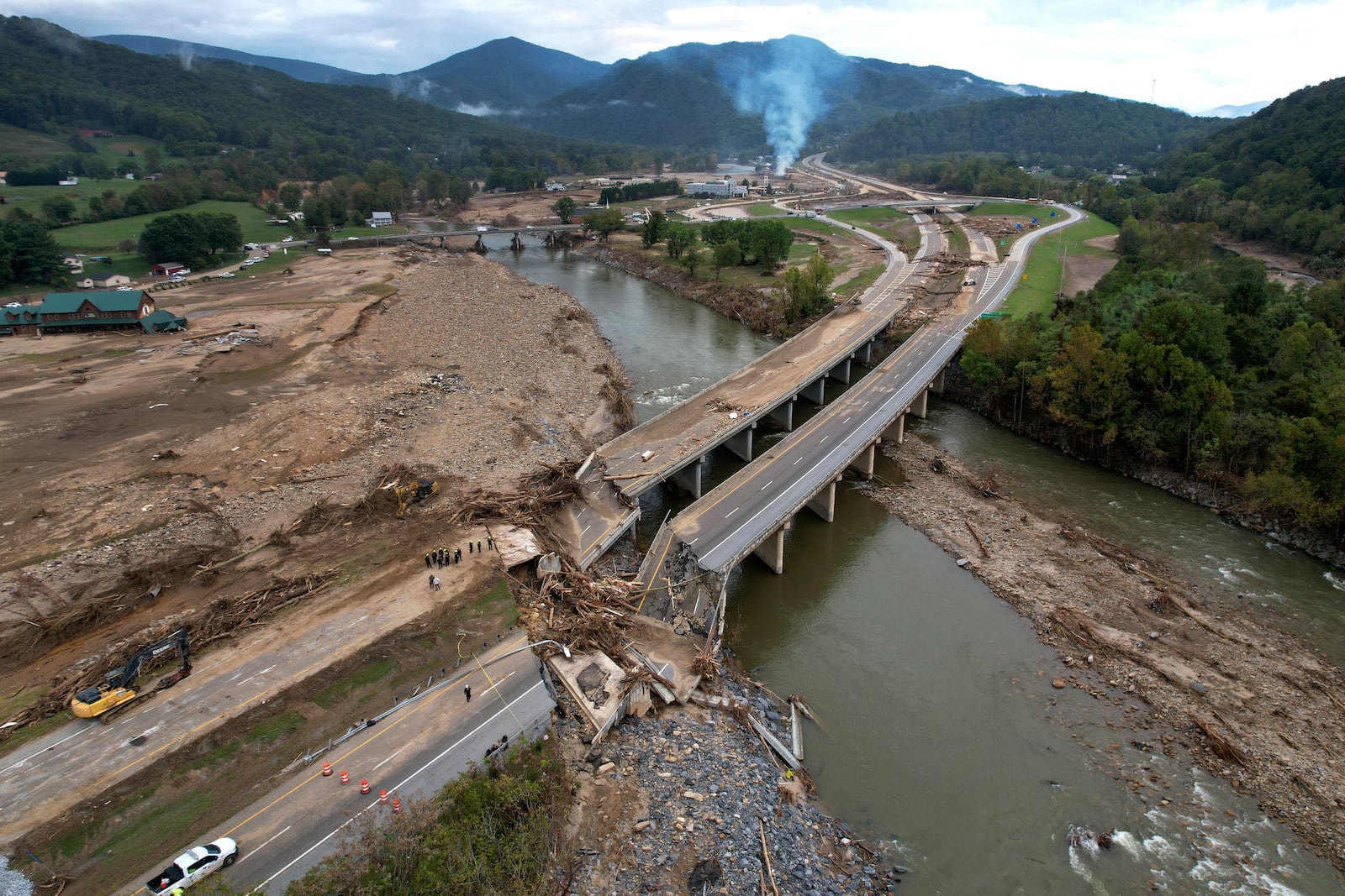 FILE - A bridge along Interstate 26 is destroyed in the aftermath of Hurricane Helene, Oct. 4, 2024, in Erwin, Tenn. (AP Photo/Jeff Roberson, File)