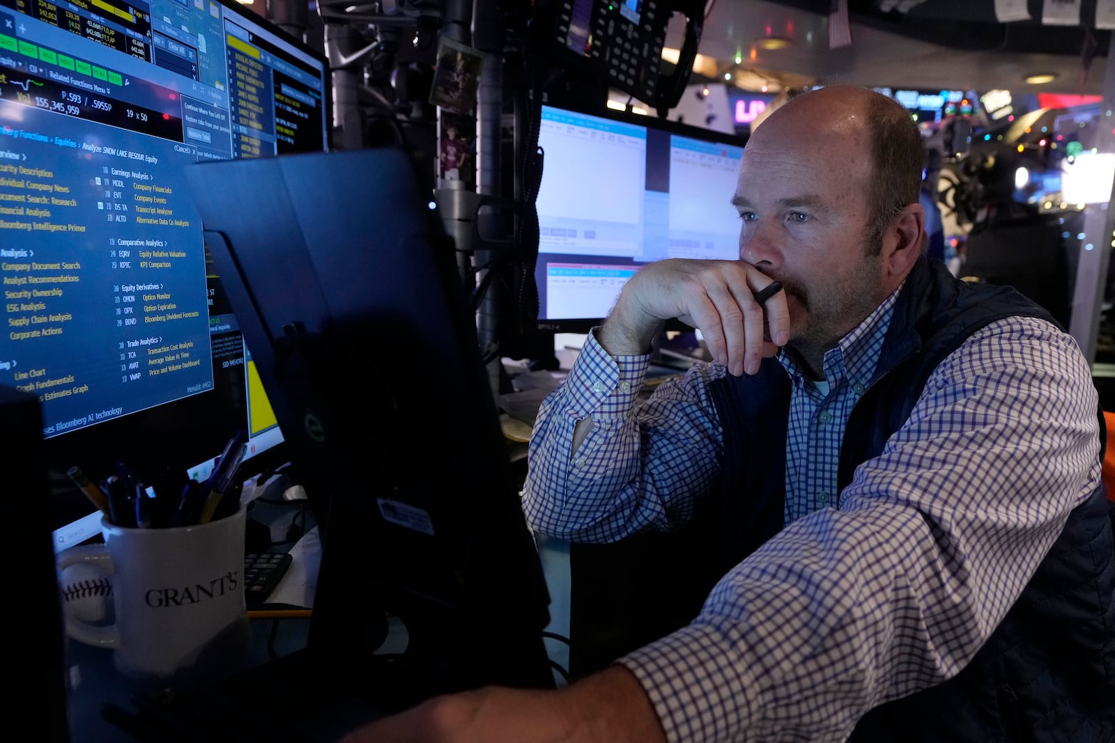 Trader Peter Mancuso works on the floor of the New York Stock Exchange, Wednesday, Dec. 18, 2024. (AP Photo/Richard Drew)