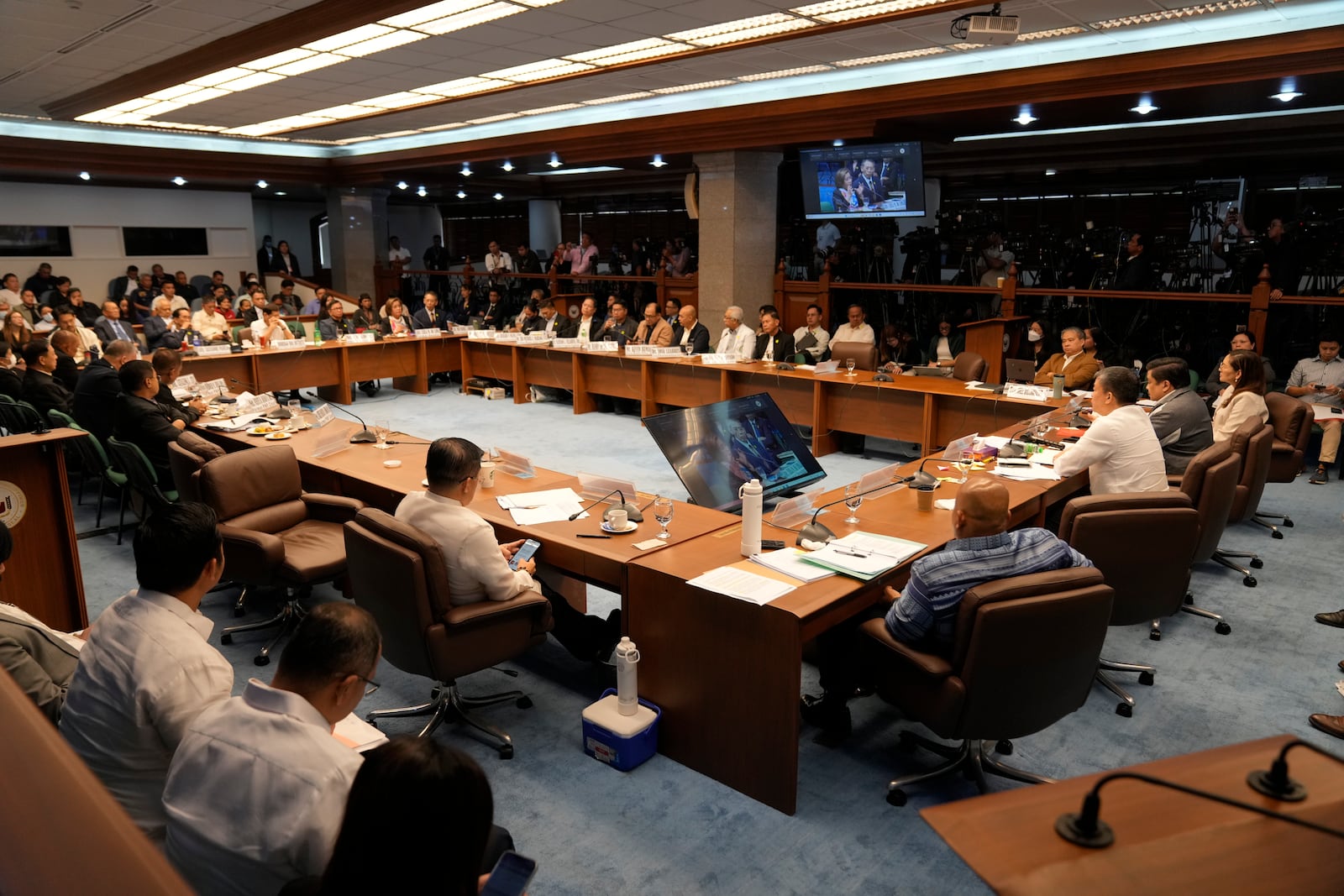 Philippine Senator Aquilino Pimentel III, right seated, leads a senate investigation on the so-called war on drugs during the administration of former Philippine President Rodrigo Duterte at the Philippine Senate Monday, Oct. 28, 2024, in Manila, Philippines. (AP Photo/Aaron Favila)