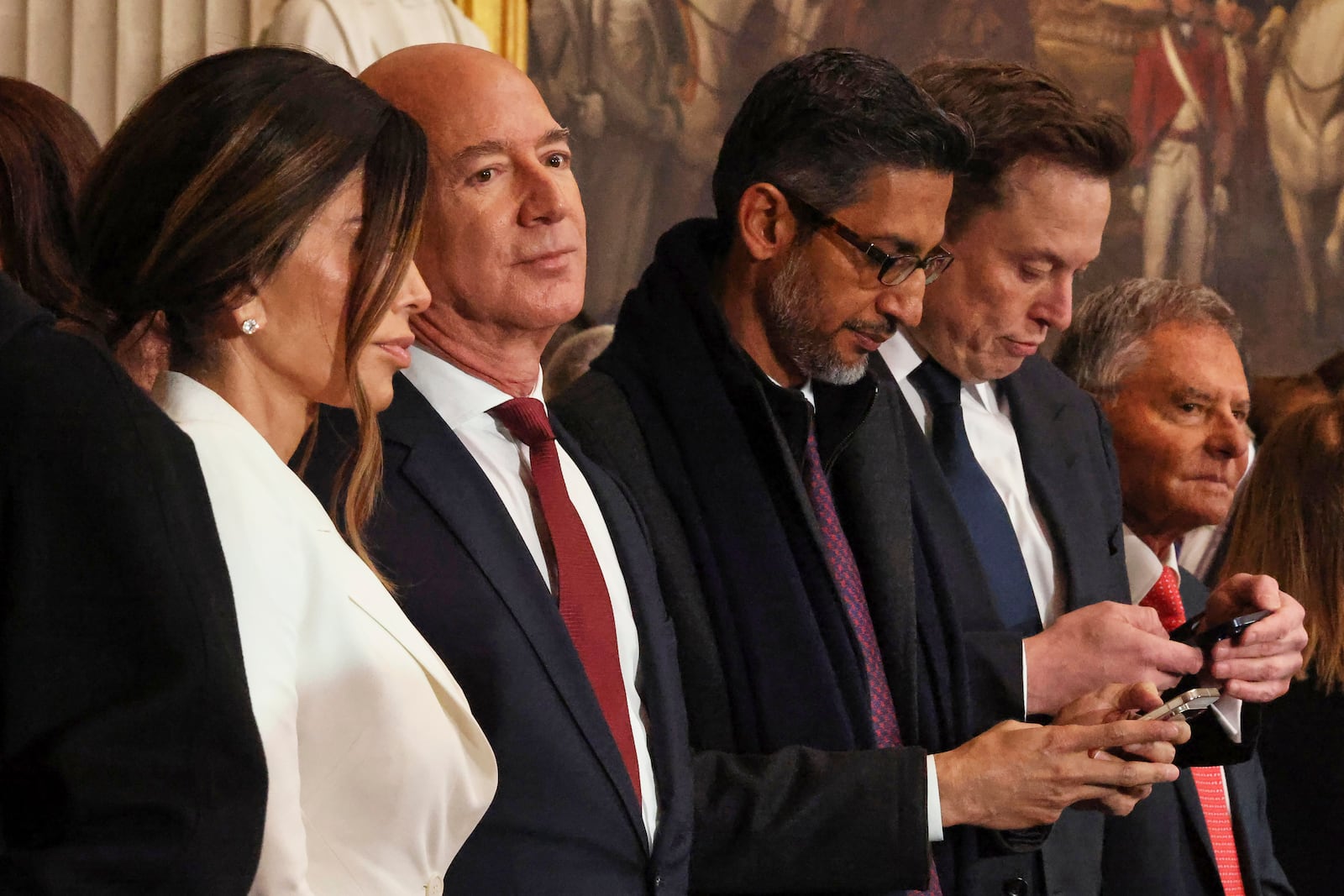 From left, Lauren Sanchez, Jeff Bezos, Sundar Pichai and Elon Musk arrive before the 60th Presidential Inauguration in the Rotunda of the U.S. Capitol in Washington, Monday, Jan. 20, 2025. (Chip Somodevilla/Pool Photo via AP)