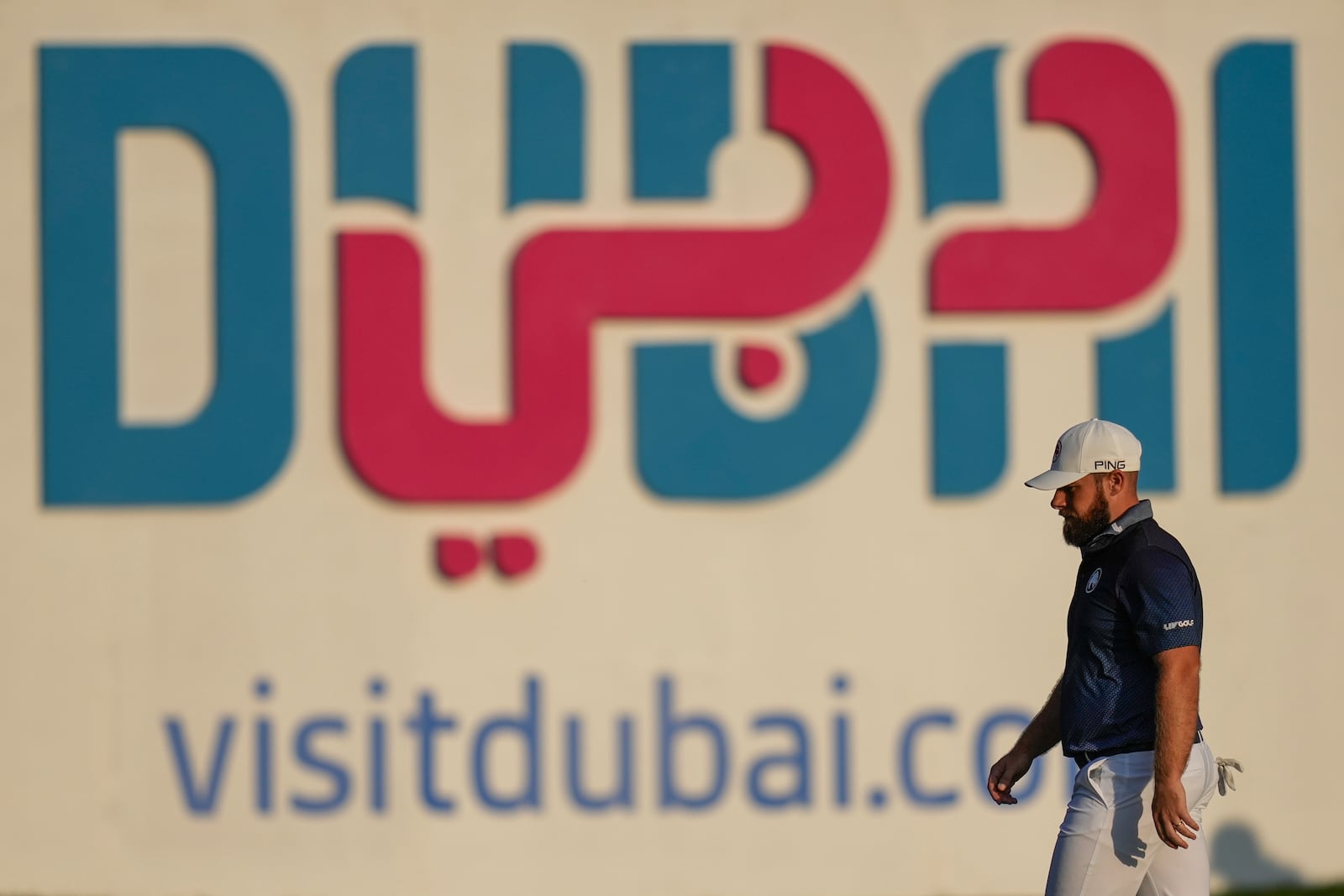 Tyrell Hatton of England prepares to plays his second shot on the 18th hole during the final round of the Dubai Desert Classic golf tournament, in Dubai, United Arab Emirates, Sunday, Jan. 19, 2025. (AP Photo/Altaf Qadri)