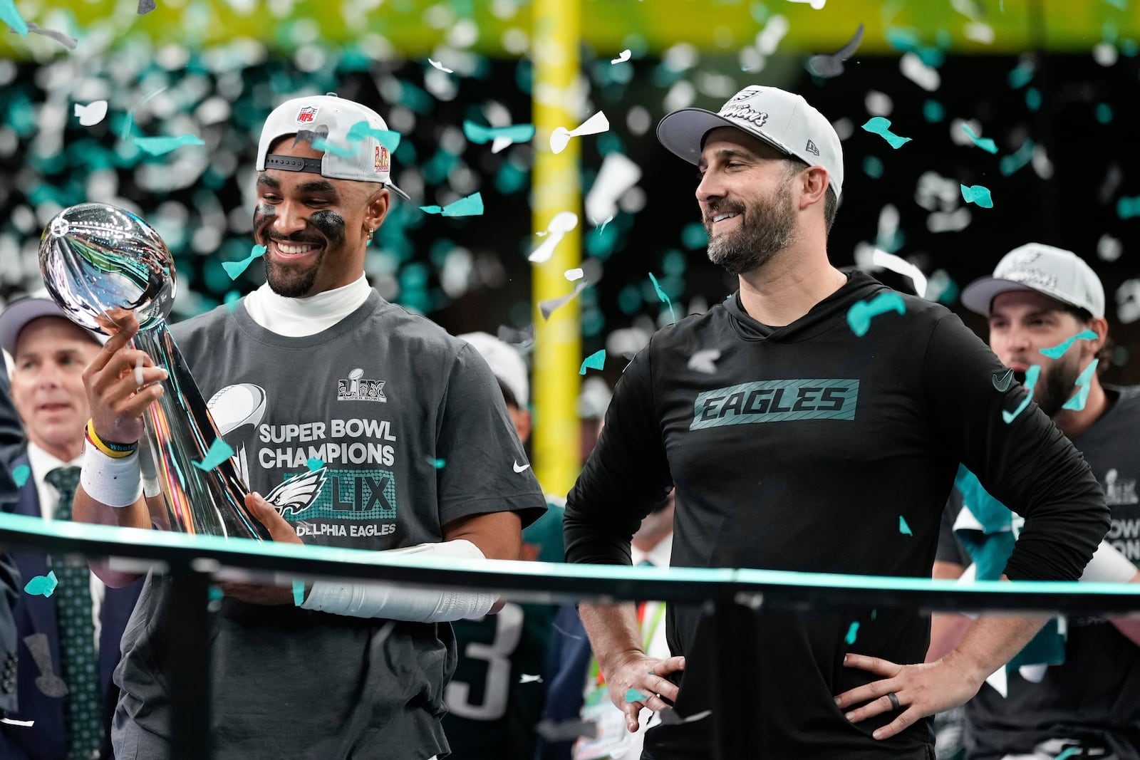 Philadelphia Eagles quarterback Jalen Hurts, left, holds the Vince Lombardi Trophy next to head coach Nick Sirianni after defeating the Kansas City Chiefs in the NFL Super Bowl 59 football game, Sunday, Feb. 9, 2025, in New Orleans. (AP Photo/Matt Slocum)