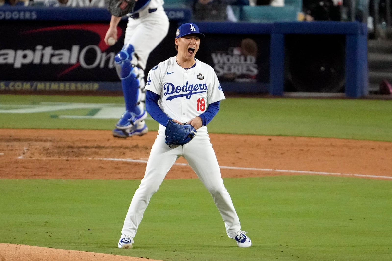 Los Angeles Dodgers starting pitcher Yoshinobu Yamamoto (18) reacts after striking out New York Yankees' Anthony Rizzo during the fourth inning in Game 2 of the baseball World Series, Saturday, Oct. 26, 2024, in Los Angeles. (AP Photo/Julio Cortez)