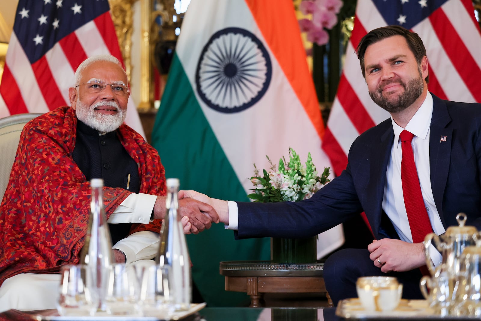 U.S. Vice President JD Vance, right, shakes hands with Indian Prime Minister Narendra Modi during a bilateral meeting, at the residence of the U.S. Ambassador on the sidelines of the Artificial Intelligence Action Summit in Paris, Tuesday Feb. 11, 2025. (Leah Millis/Pool via AP)