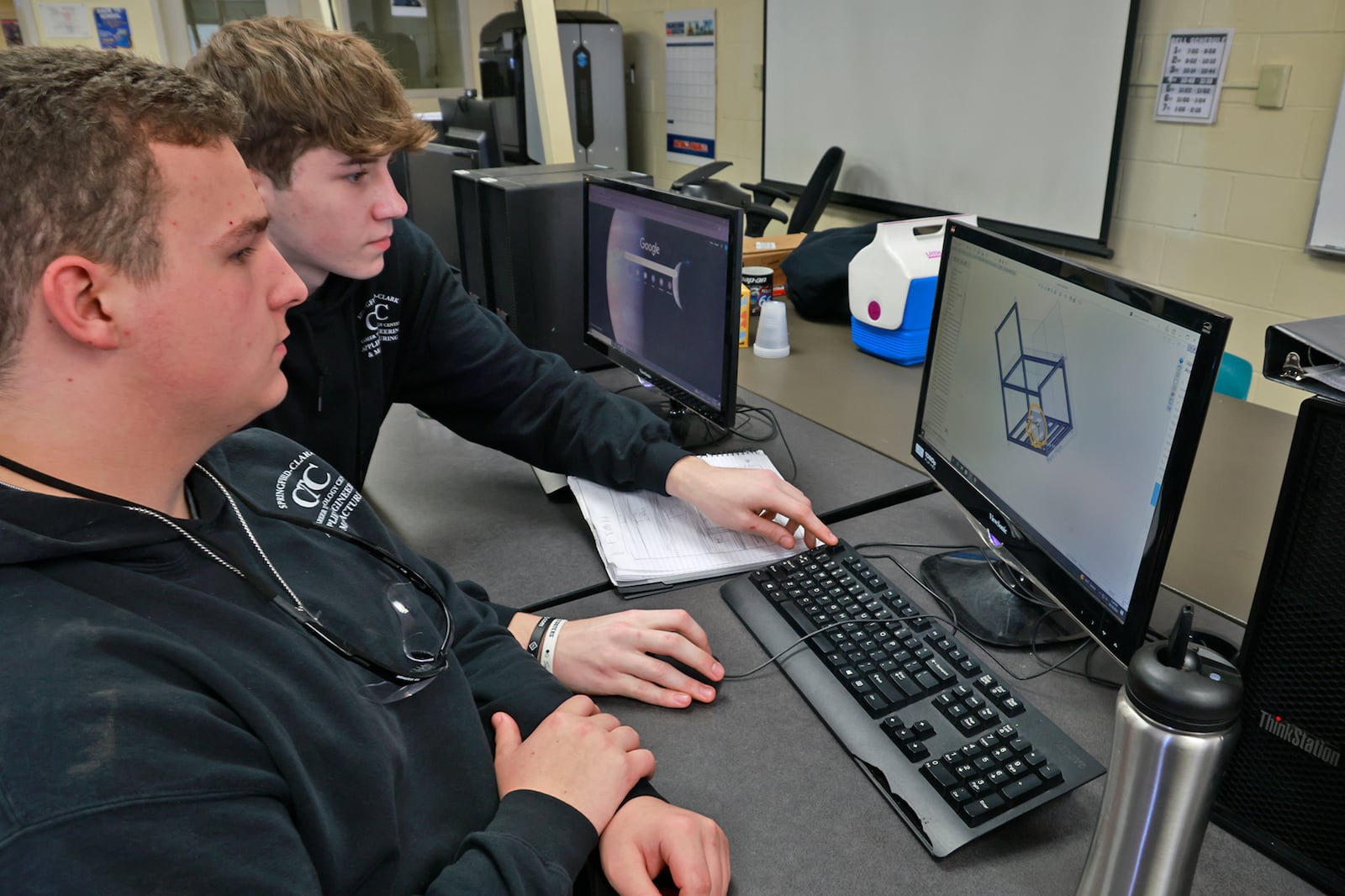 Daniel Bowers, senior, Springfield High School, and Caleb Ricketts, senior, Northeastern High School, work on a computer aided design project in the Applied Engineering & Manufacturing program Friday, Oct. 18, 2024. BILL LACKEY/STAFF