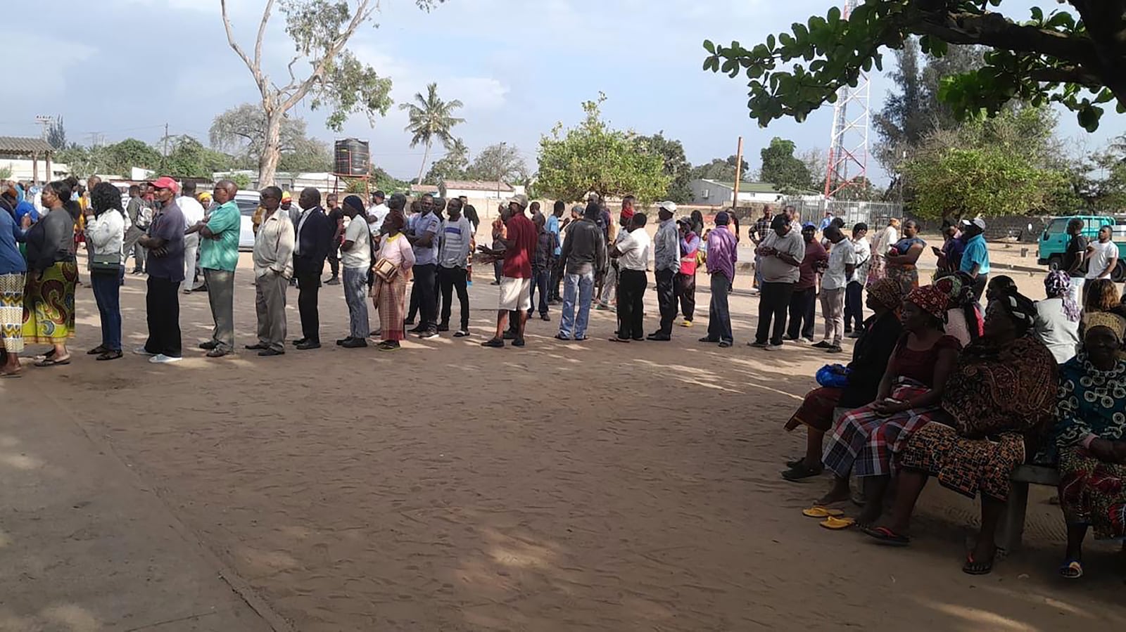 People queue to cast their votes during the general elections in Maputo, Mozambique, Wednesday, Oct. 9, 2024. (AP Photo/Charles Mangwiro)