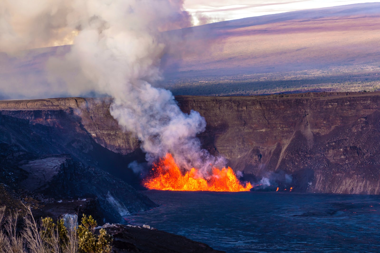 In this photo provided by the National Park Service, an eruption takes place on the summit of the Kilauea volcano in Hawaii, Monday, Dec. 23, 2024. (Janice Wei/NPS via AP)