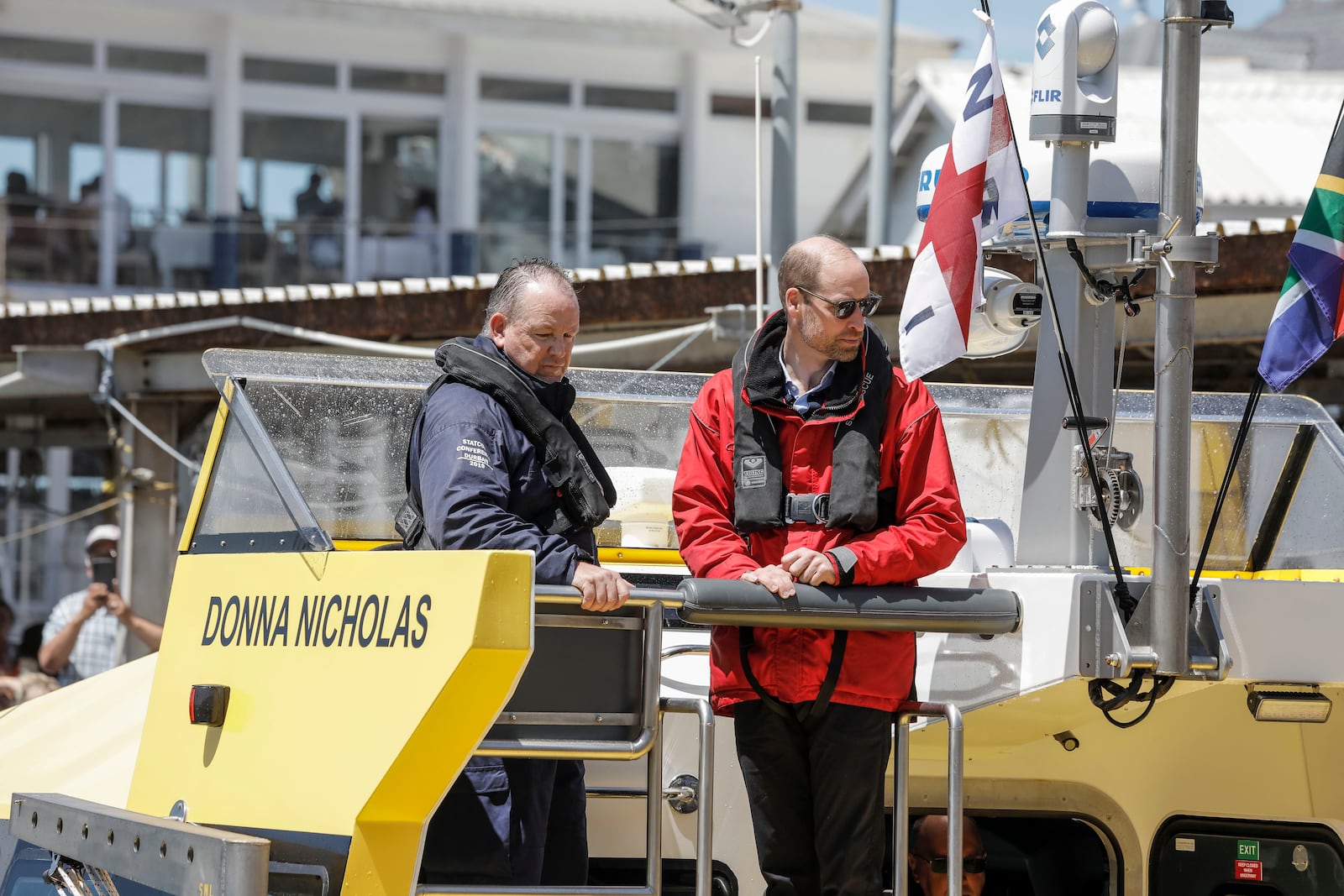 Britain's Prince William, the Prince of Wales, arrives on board a National Sea Rescue Institute (NSRI) boat to meet 2023 Earthshot finalist ABALOBI, at Kalk Bay Harbour, near Cape Town, Thursday, Nov. 7, 2024. (Gianluigi Guercia/Pool Photo via AP)