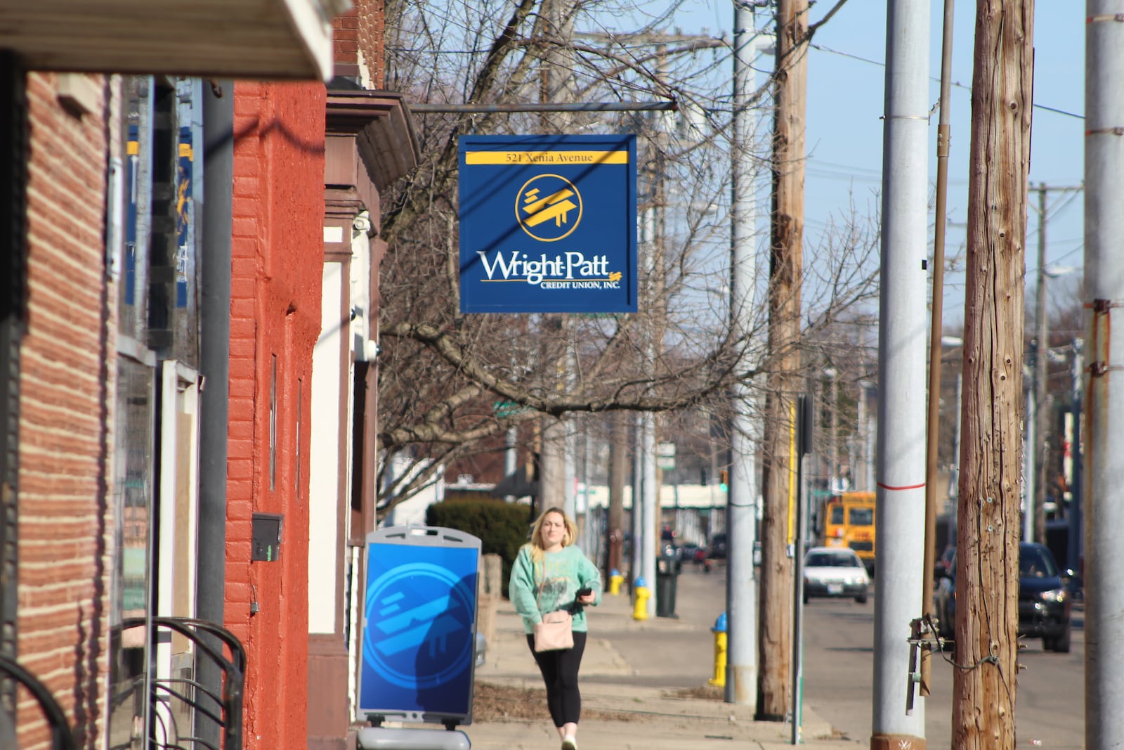 A woman outside of Wright-Patt Credit Union on Xenia Avenue in East Dayton. CORNELIUS FROLIK / STAFF