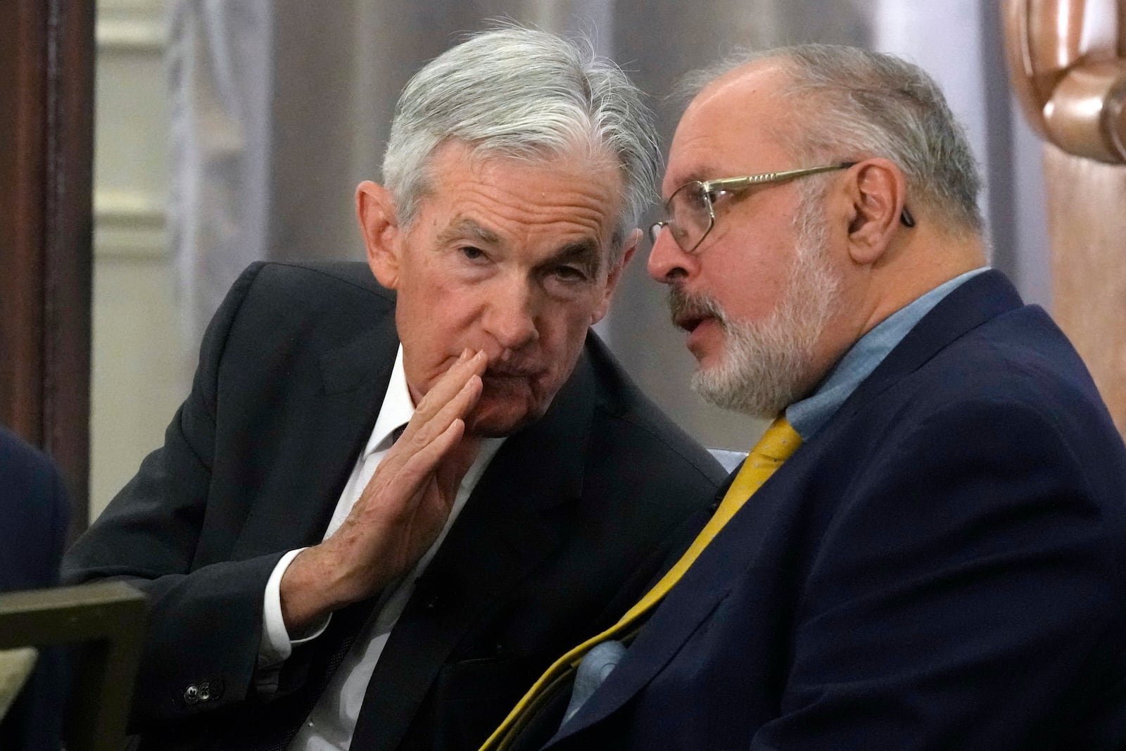 Federal Reserve Chair Jerome Powell, left, talks with Anil Kashyap, Professor of Economics and Finance at the University of Chicago's Booth School of Business,, before his address to the annual U.S. Monetary Policy Forum, in New York, Friday, March 7, 2025. (AP Photo/Richard Drew)