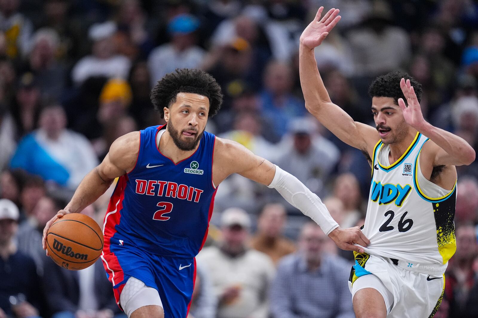 Detroit Pistons guard Cade Cunningham (2) drives on Indiana Pacers guard Ben Sheppard (26) during the first half of an NBA basketball game in Indianapolis, Wednesday, Jan. 29, 2025. (AP Photo/Michael Conroy)