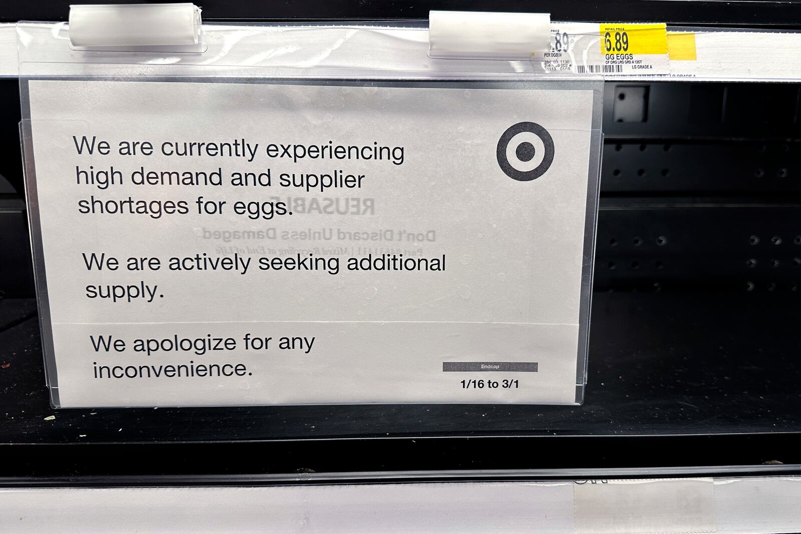 A sign is mounted on a shelve of eggs at a grocery store in Chicago, Saturday, Feb. 8, 2025. (AP Photo/Nam Y. Huh)