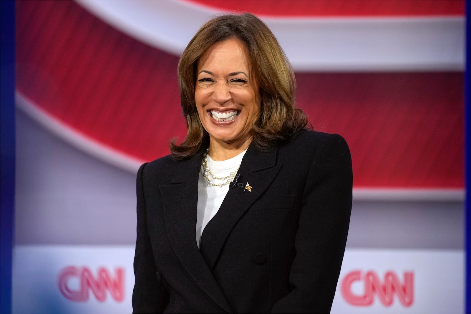 Democratic presidential nominee Vice President Kamala Harris speaks during a CNN town hall in Aston, Pa., Wednesday, Oct. 23, 2024, as moderator Anderson Cooper listens. (AP Photo/Matt Rourke)